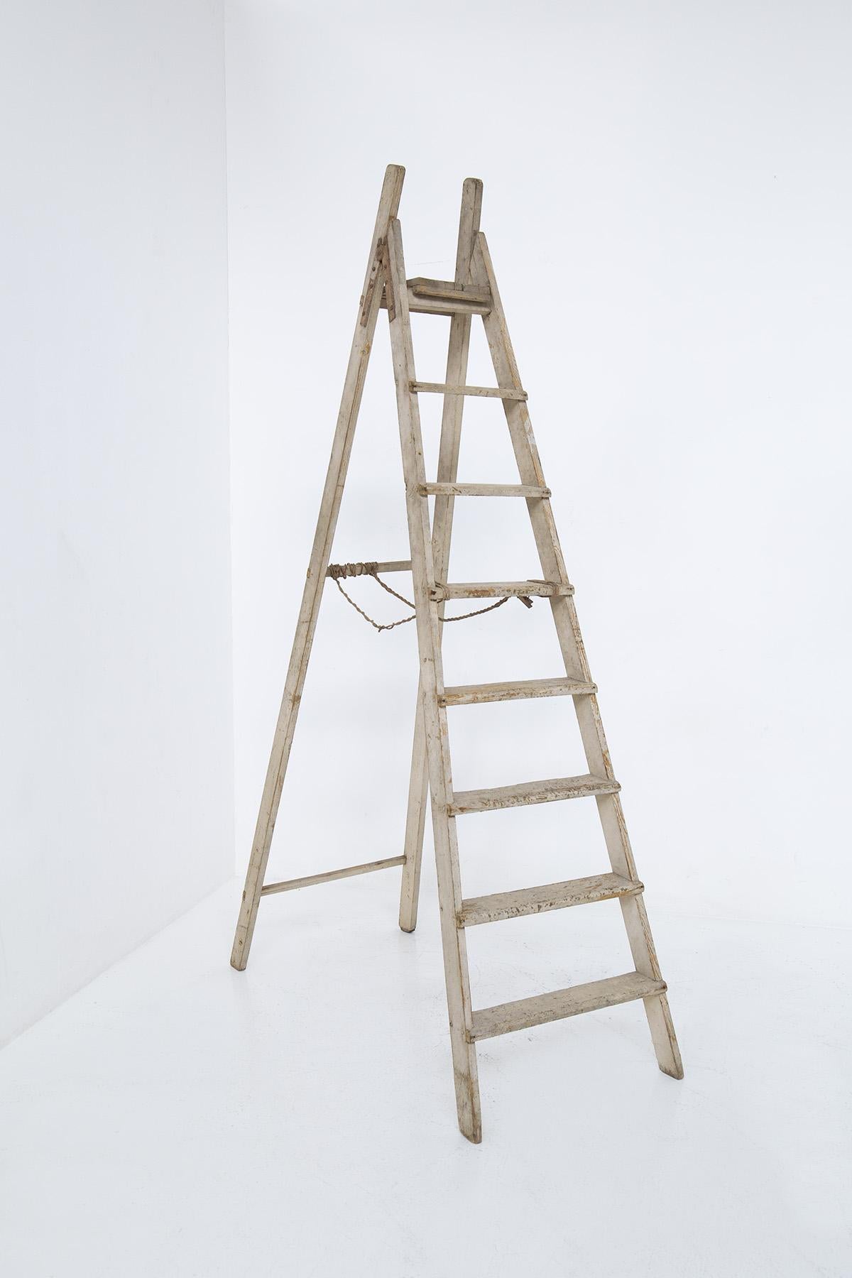 Large Italian Vintage Rustic Decorative Ladder from the 1920s The ladder is made of painted wood.
The ladder is a beautiful painted wood decorative element from the Rustic Chic period of the early 1920s, made in Italy. It can also be placed as in