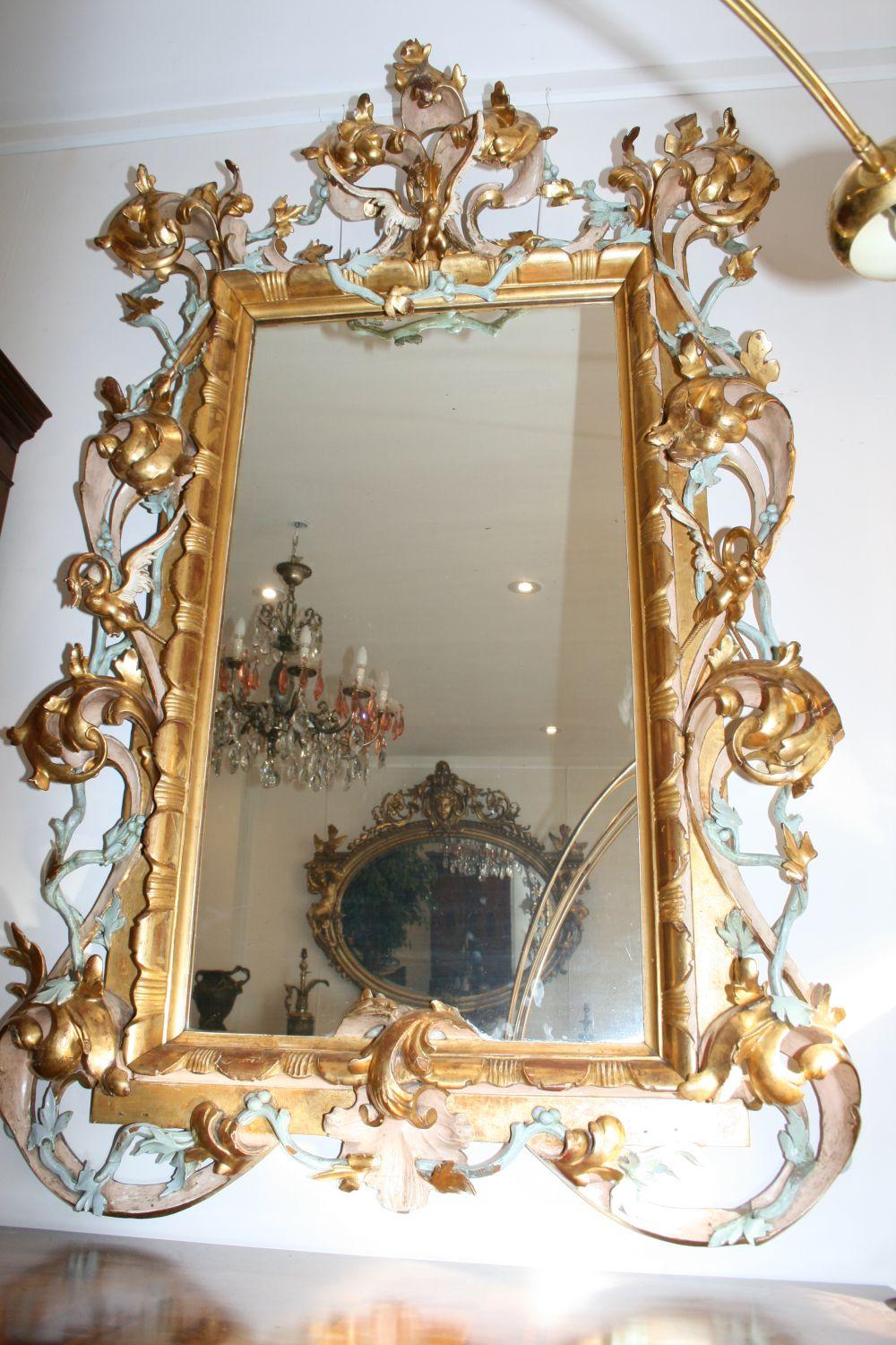 Very large & decorative antique giltwood mirror dating from the early 19th century & possibly older. We believe it’s Italian & very unusual in the way it’s not only gilt, but has light blue & cream finishes too. The frame is beautiful & has