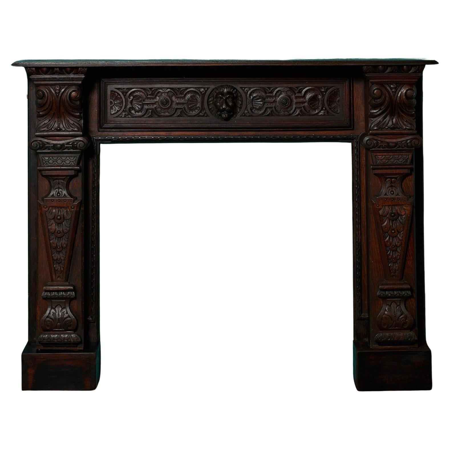 Grande cheminée ancienne en chêne foncé de style Jacobean