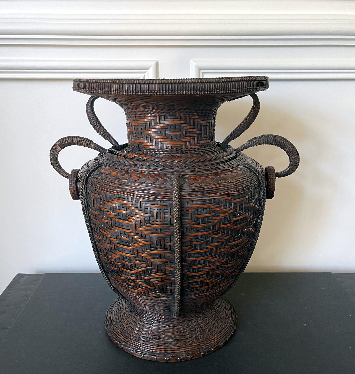 This woven bamboo flower basket (Hanakago) of impressive presence was constructed in a classic Chinese form derived from the shape of porcelain vase known as 