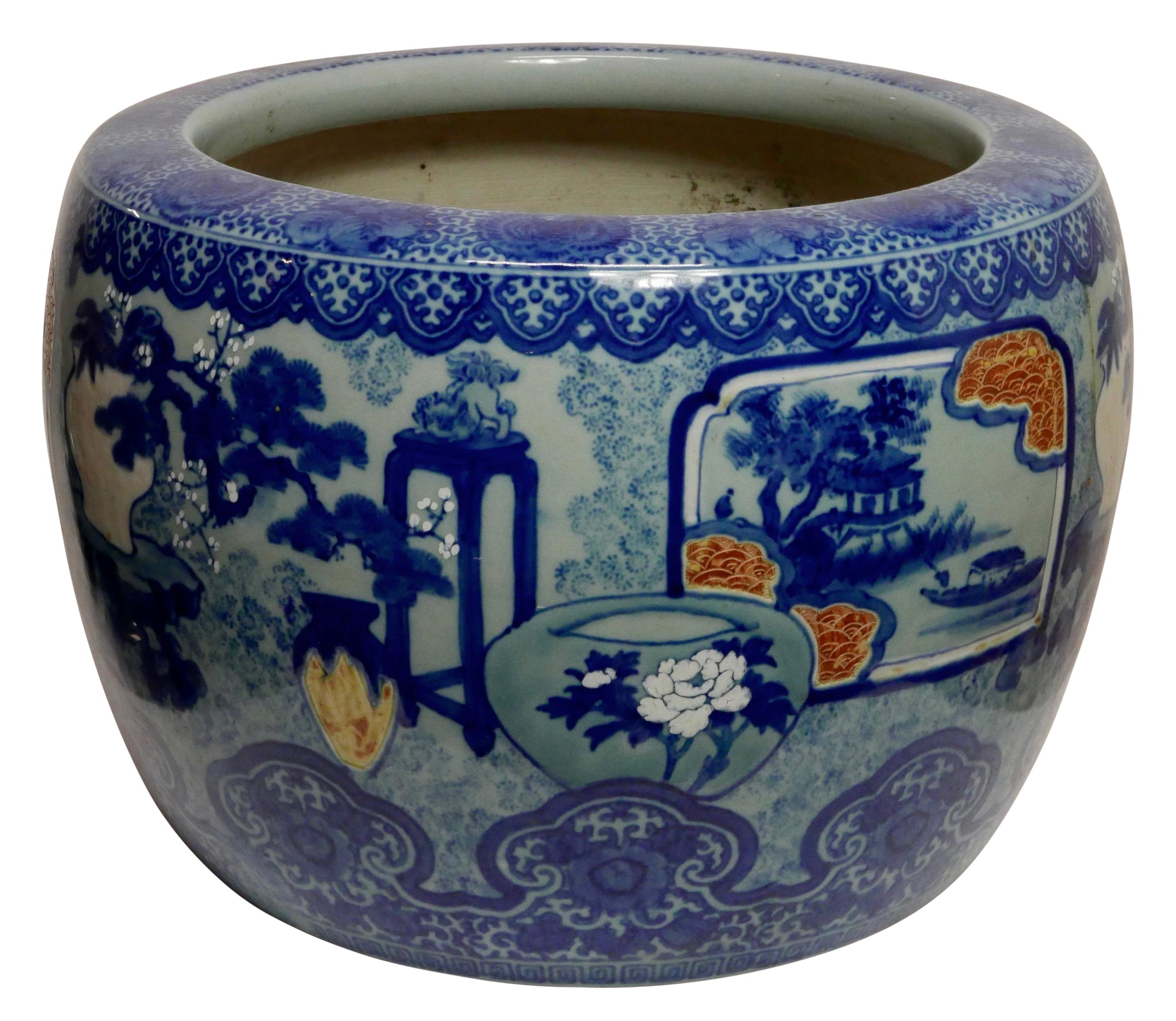 A large Japanese blue and white jardinière with scenic panels and all over floral designs.
First quarter of the 20th century.


 