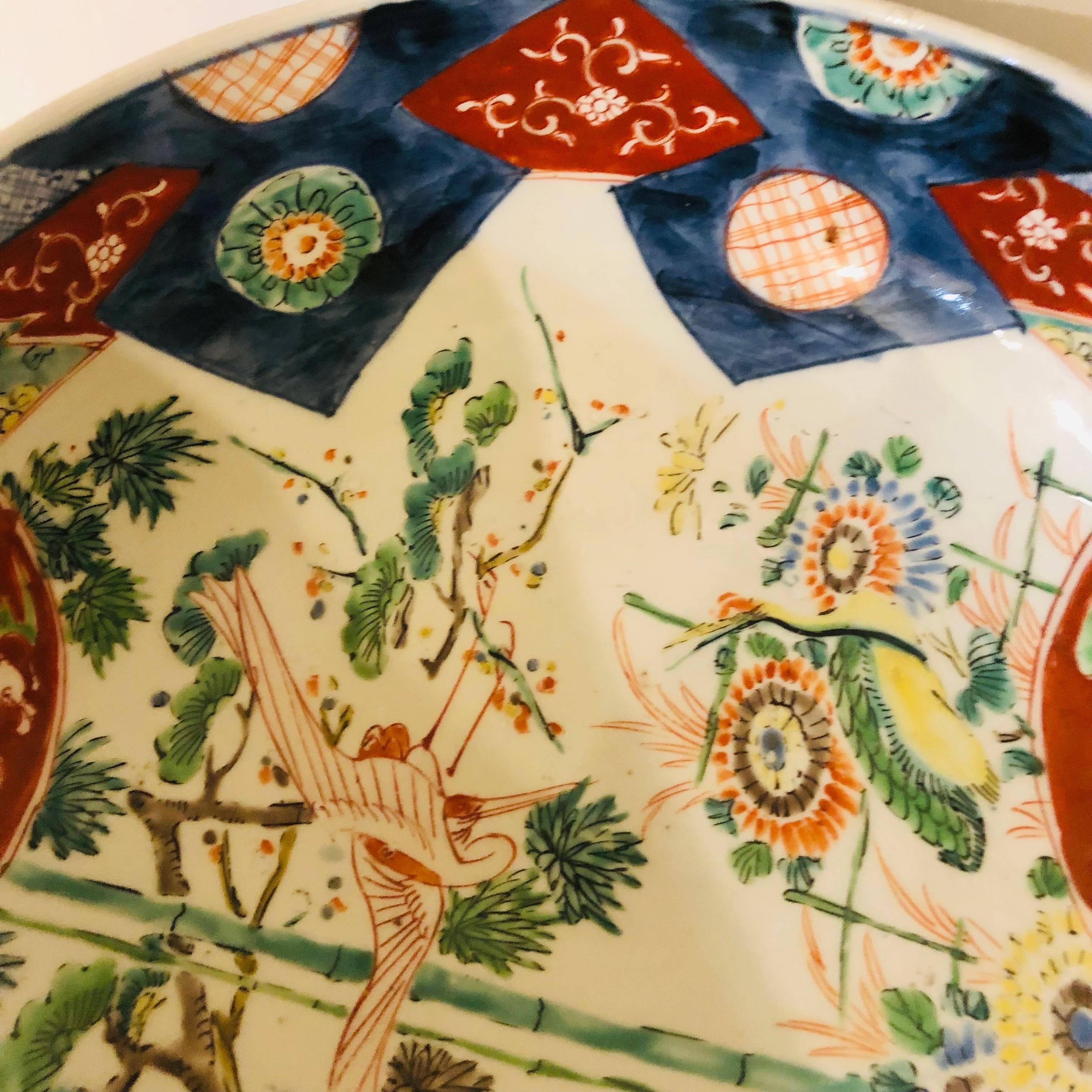 Large Antique Japanese Imari Bowl Decorated With Whimsical Birds and Trees 9