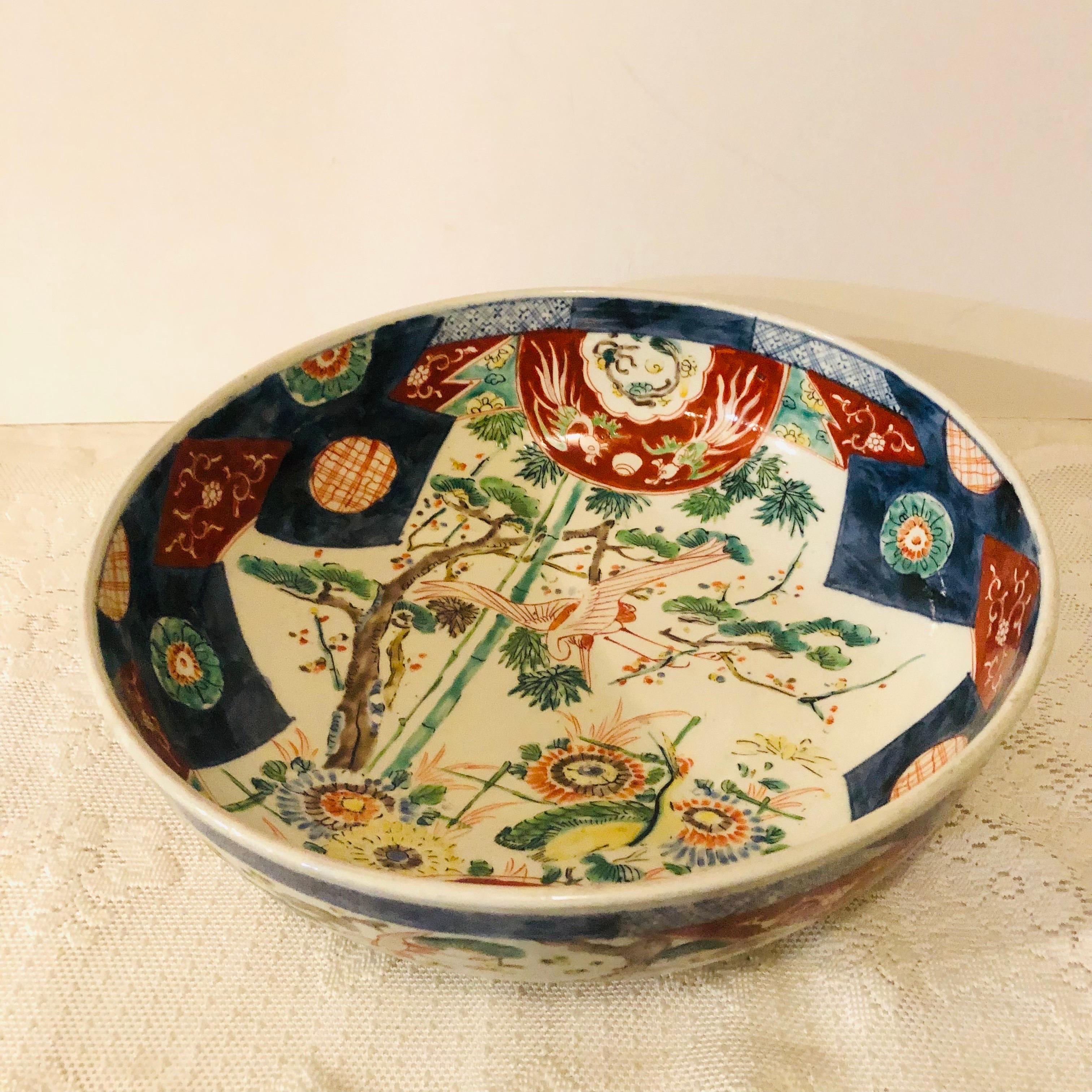 Hand-Painted Large Antique Japanese Imari Bowl Decorated With Whimsical Birds and Trees