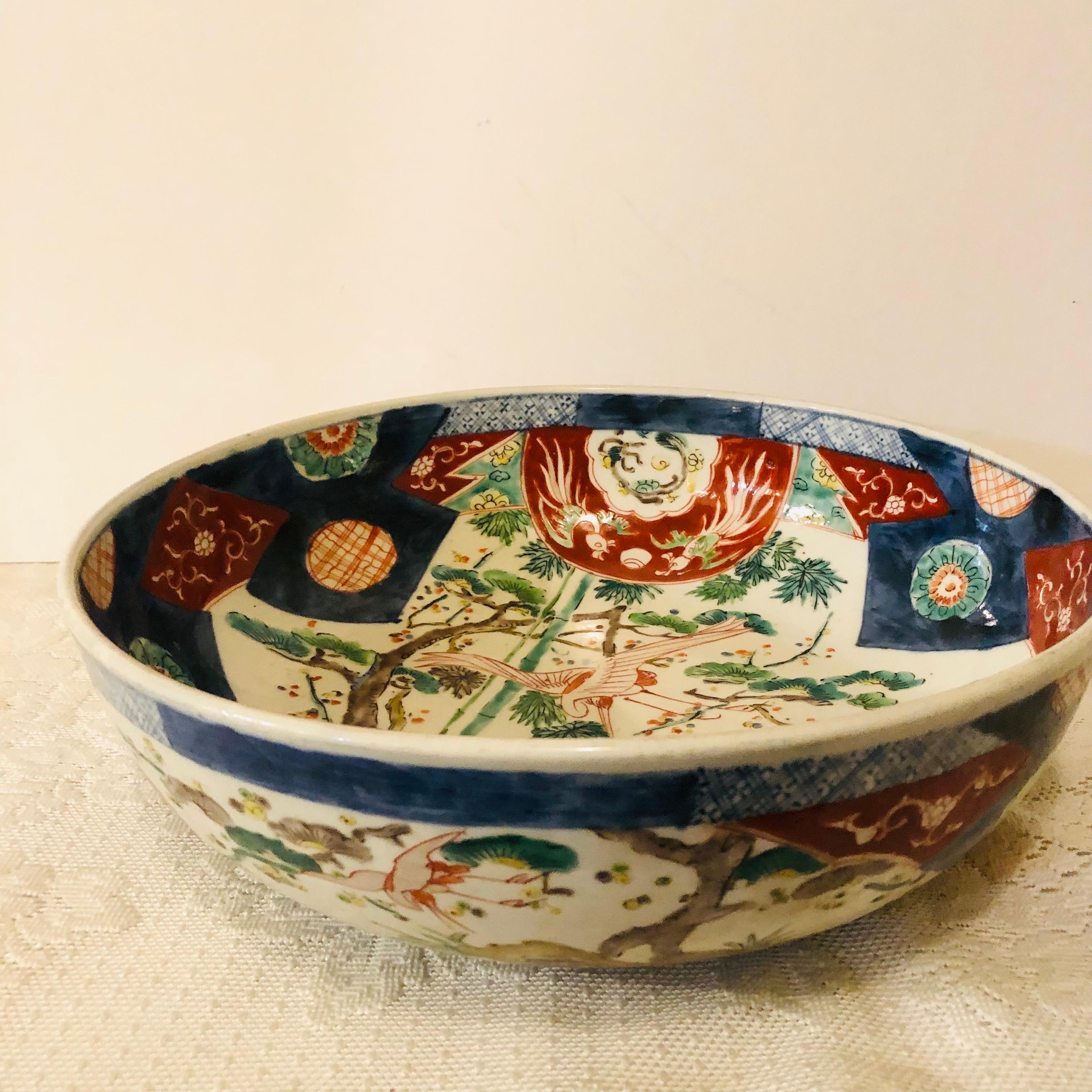 Large Antique Japanese Imari Bowl Decorated With Whimsical Birds and Trees In Good Condition In Boston, MA