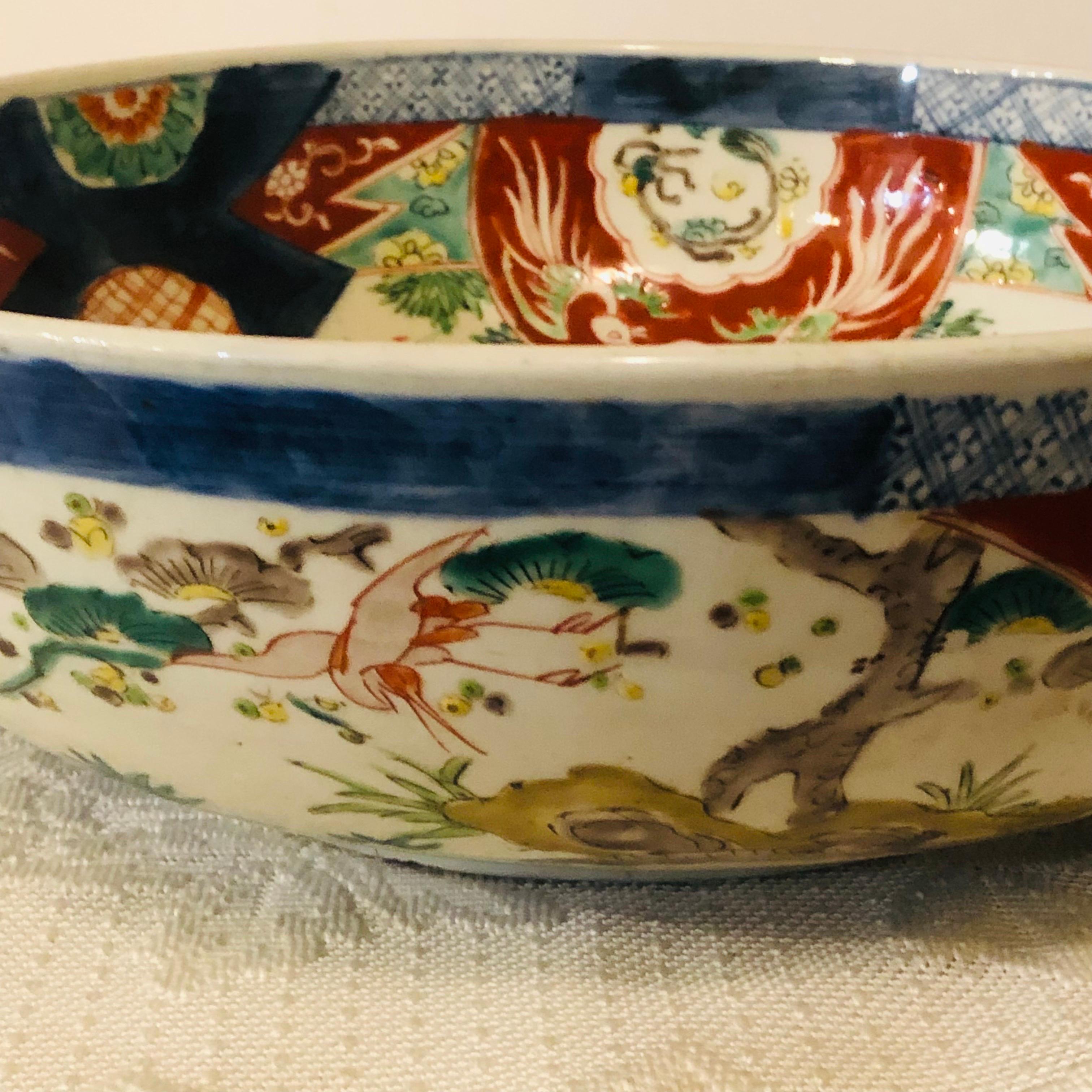 Porcelain Large Antique Japanese Imari Bowl Decorated With Whimsical Birds and Trees