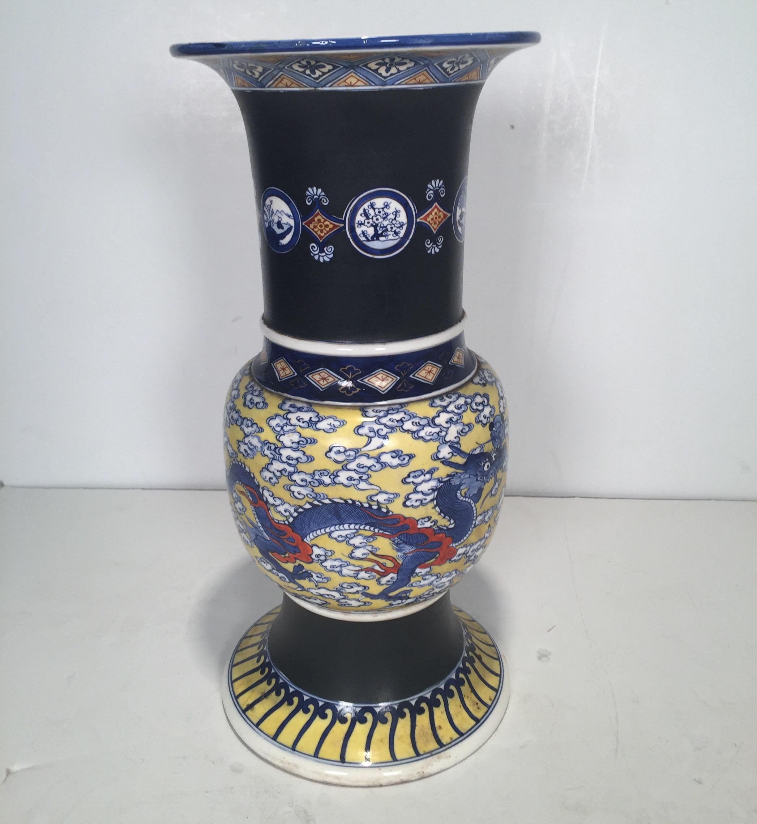 A magnificent Makuzu Kozan Studio Pottery vase circa 1900 in a striking color combination of black, yellow, red, and cobalt. Makuzu (1842-1916) was a master Japanese ceramist. He was appointed artist to the Japanese Imperial household and was one of