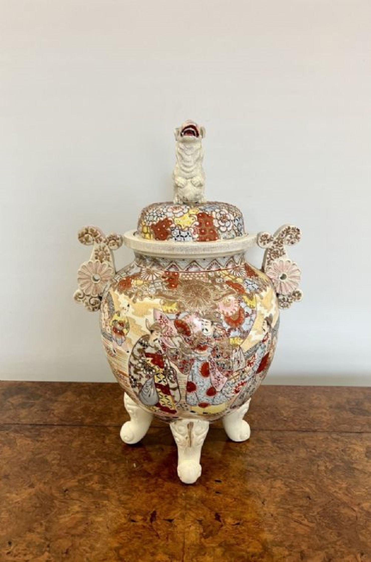 Large antique Japanese quality Satsuma lidded vase having a quality antique Japanese satsuma lidded vase with a dog sitting on the original lid above a circular wonderful hand painted bulbous vase in red, gold, yellow, pink and blue colours standing