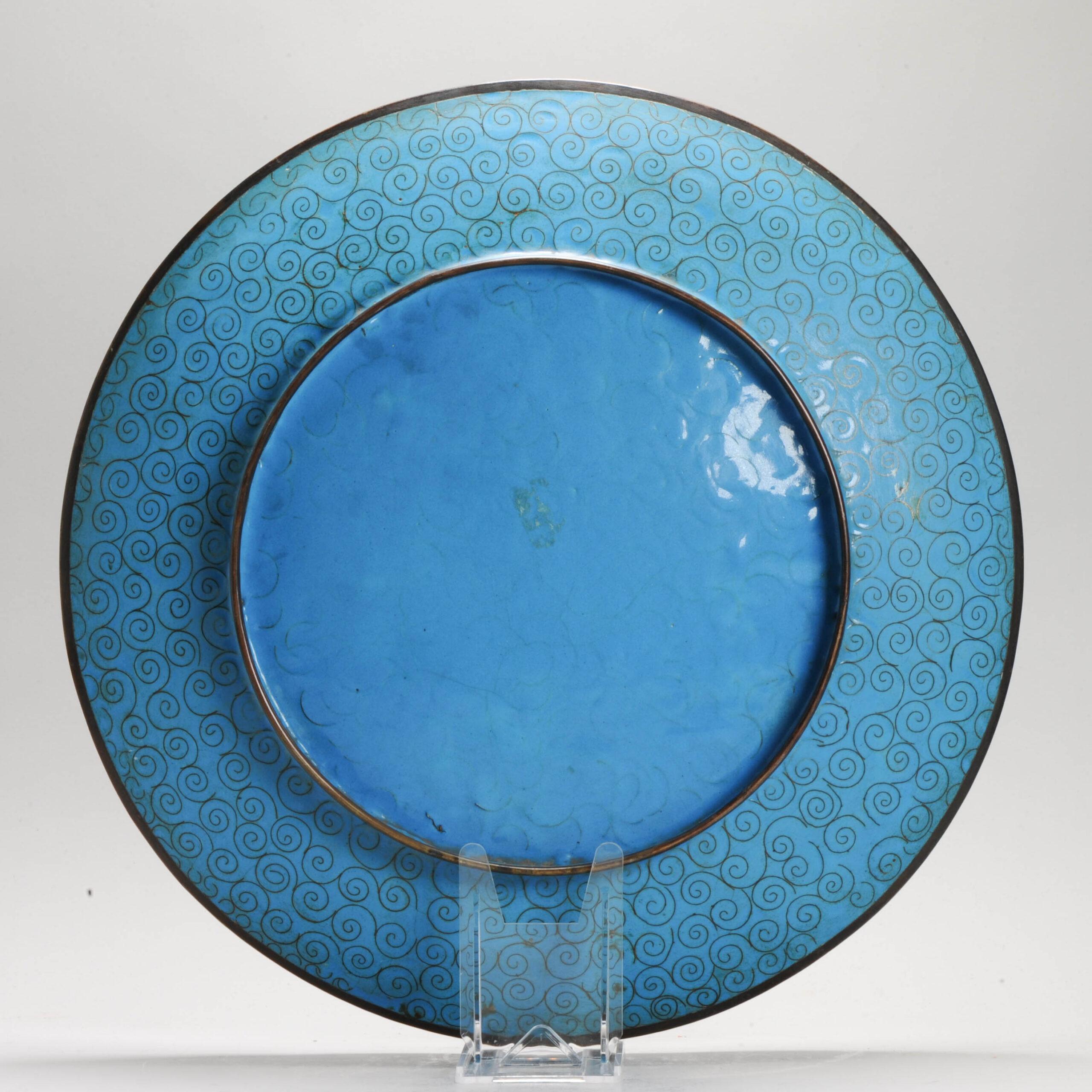 Lovely and beautifully made piece with different kind of flowers and birds on a green  base.

Cloisonné is an enamelling technique in which the pattern is formed by wires soldered to the surface of the object to be decorated, which is usually made