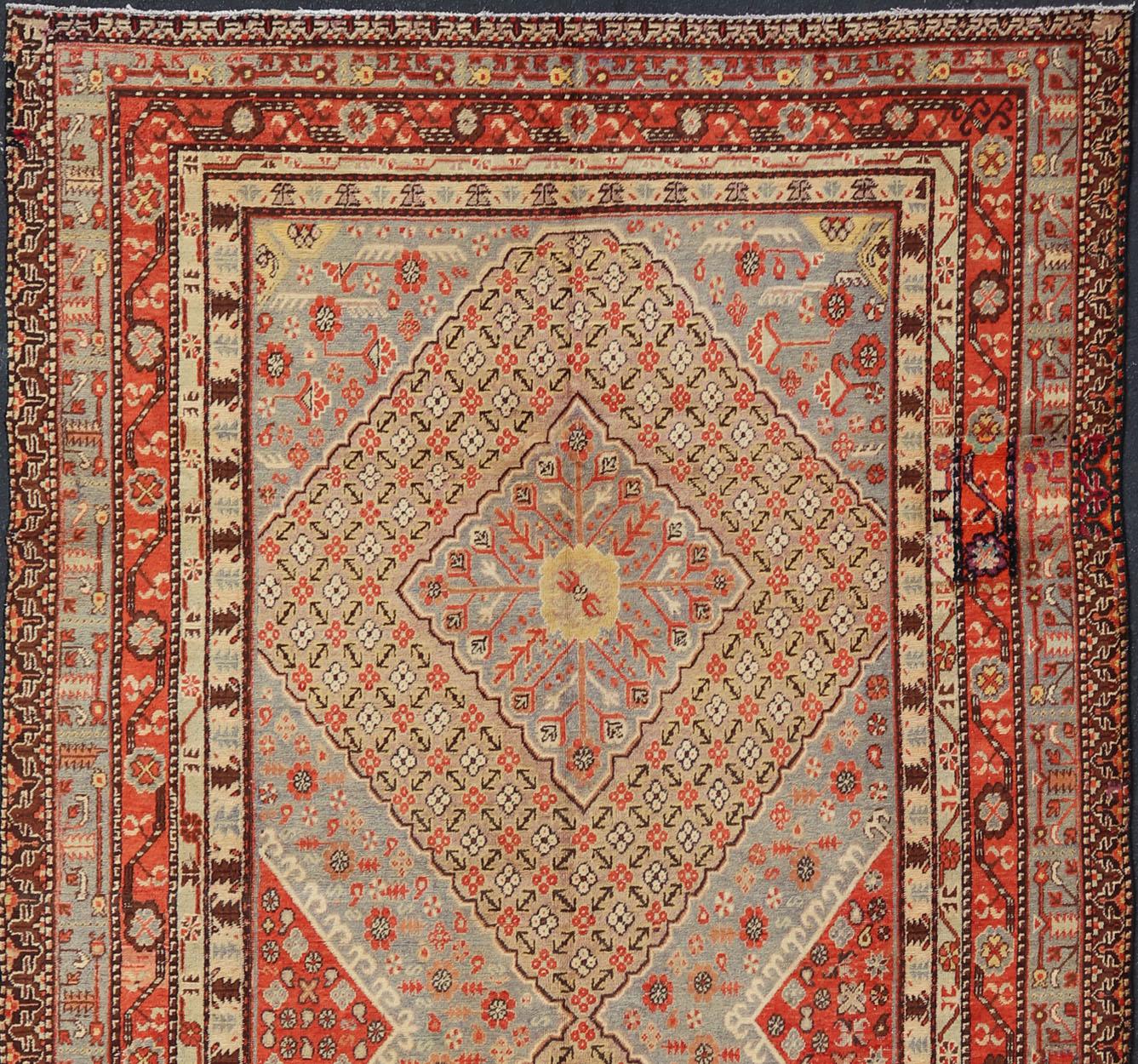 Turkmen Large Antique Khotan Gallery Rug with Diamonds in Yellow, Orange, Brown & Gray For Sale