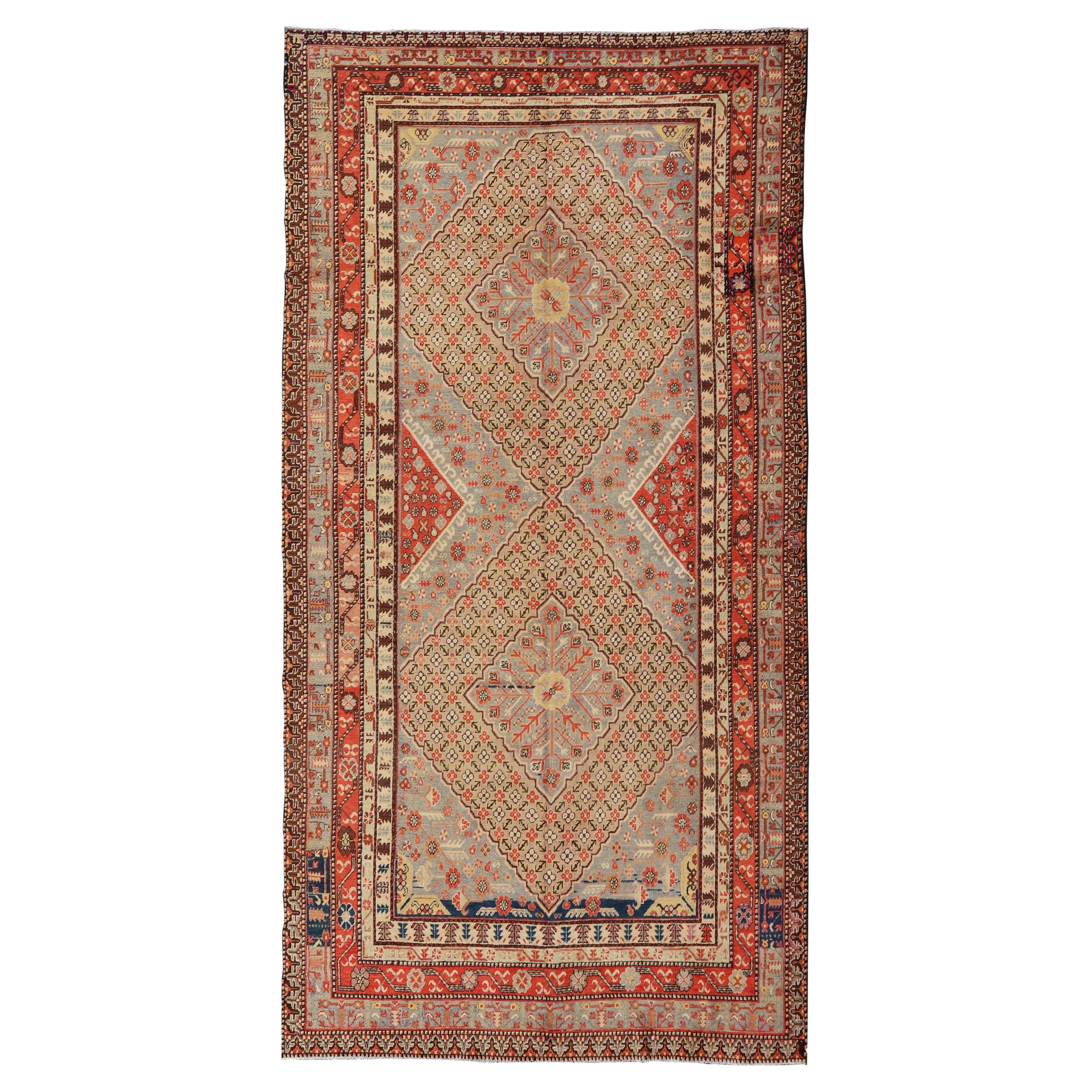 Gran alfombra antigua Khotan Gallery con diamantes en amarillo, naranja, marrón y gris en venta