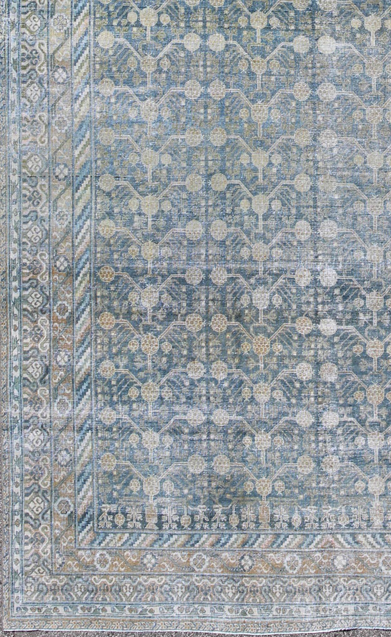 Antique Khotan rug with blue all-over design of blossoms and flowers, large Khotan from Turkestan rug sus-1803-387, country of origin / type: Turkestan / Khotan, circa 1910

This attractive antique Khotan rug (circa 1910) is a spectacular