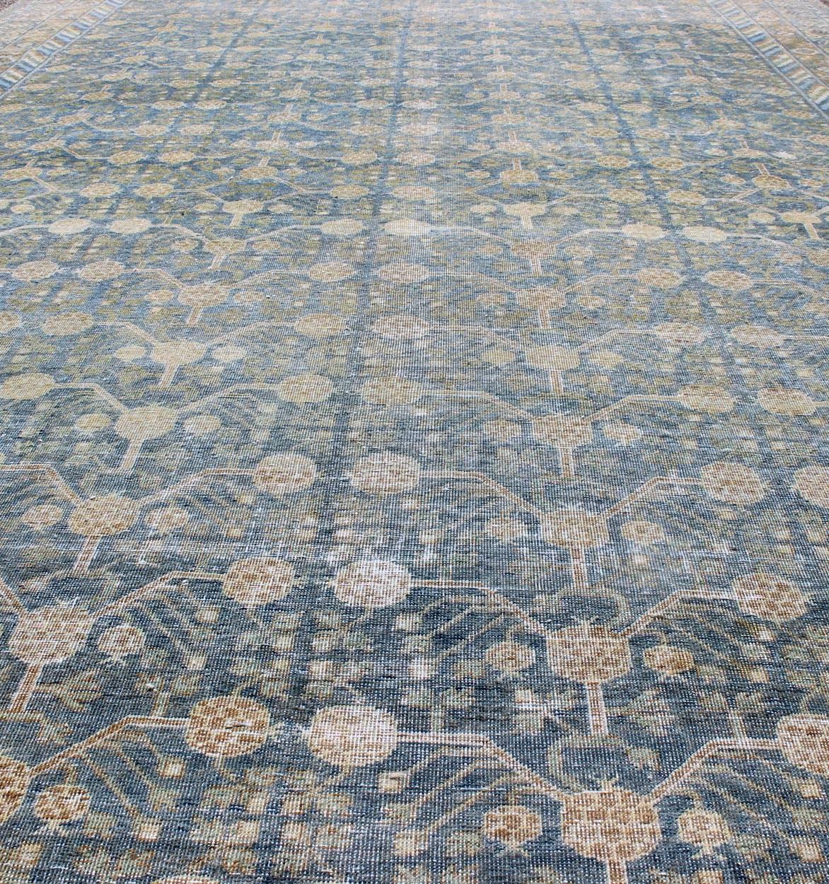Large Antique Khotan Rug with Blue All-Over Design of Blossoms and Flowers In Good Condition For Sale In Atlanta, GA