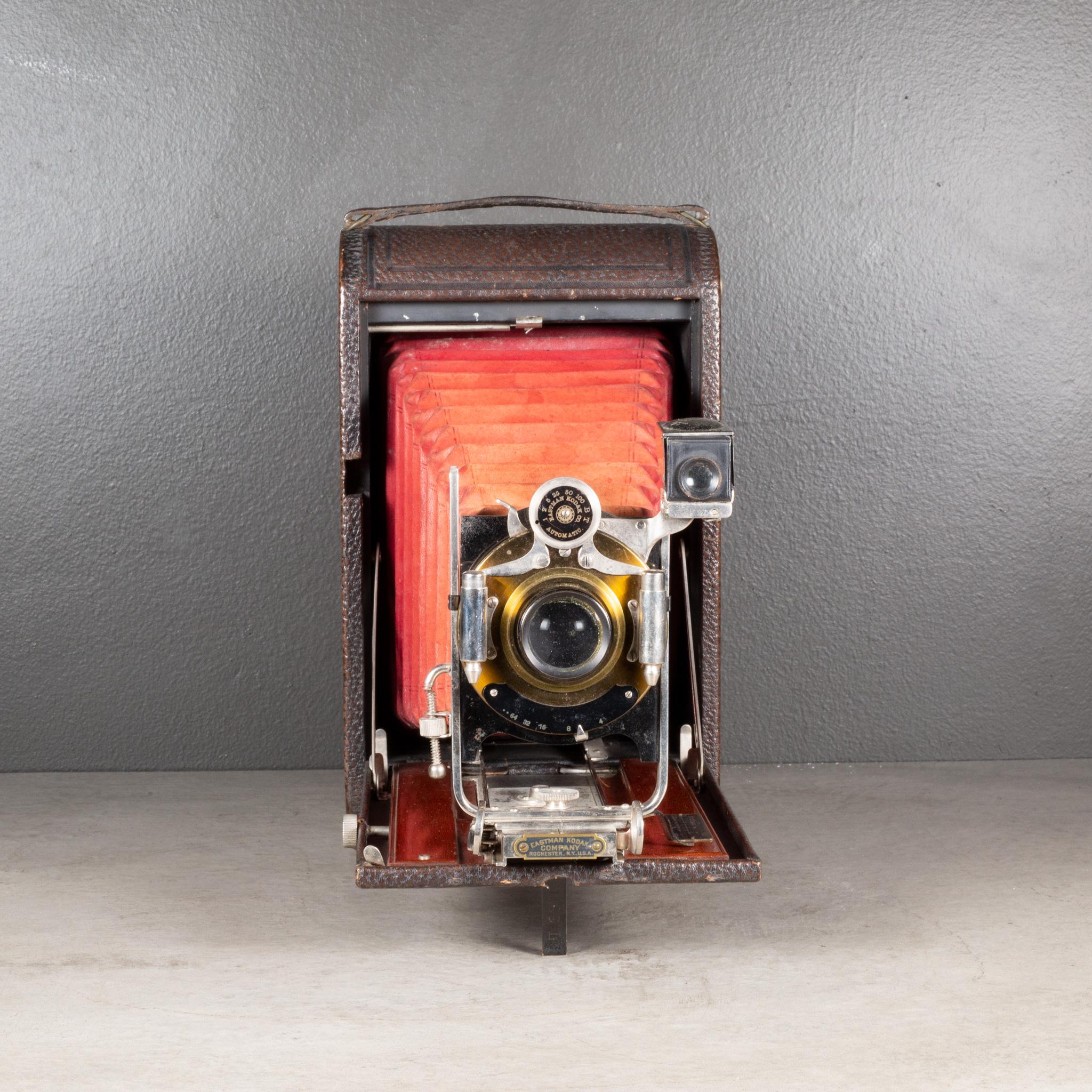 ABOUT

A large Eastman Kodak No. 3A folding camera with red bellows and Mahogany inlay. The body is wrapped in leather with chrome and brass accents. The camera folds to 2.5 inches. This piece has retained its original finish with minor structurally