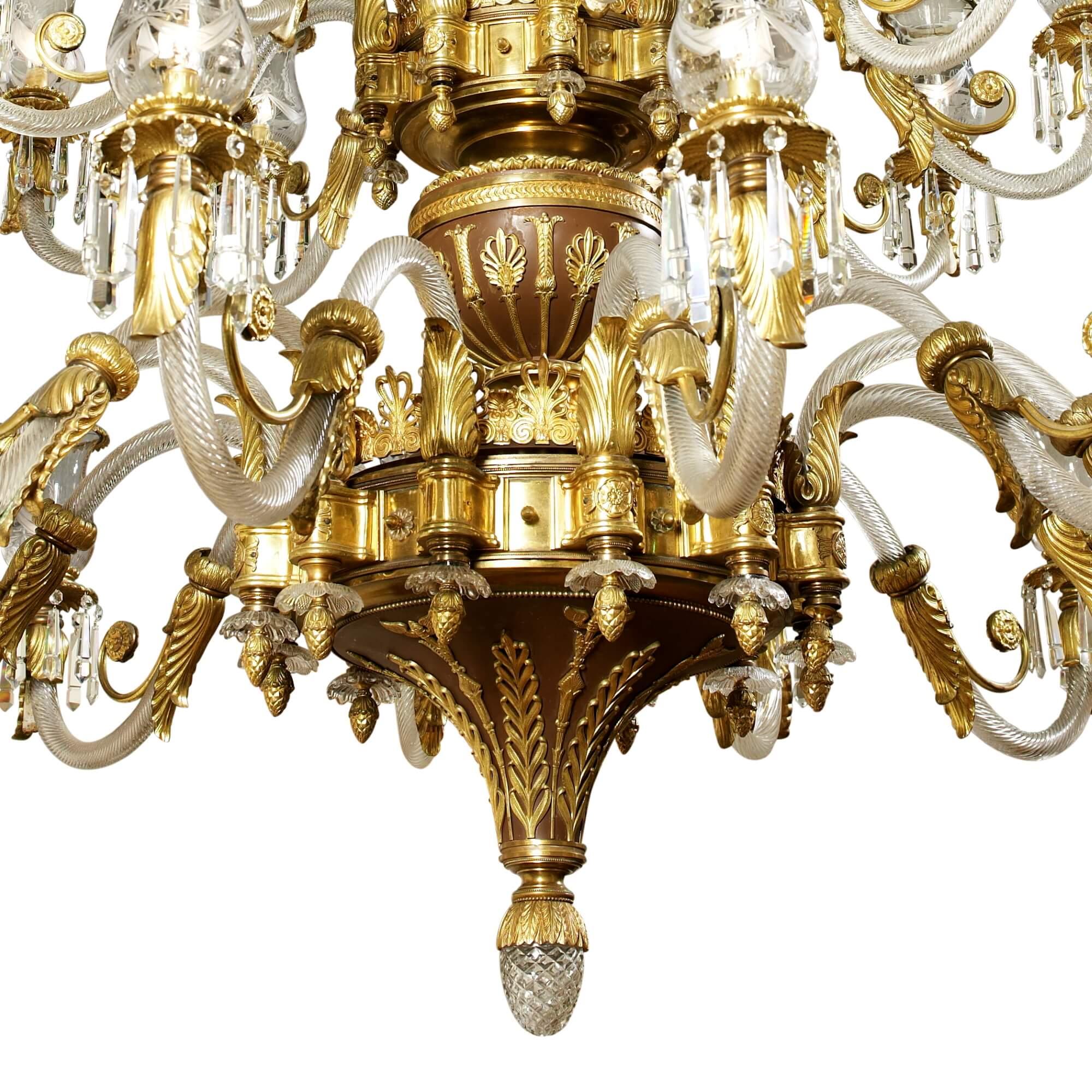 Large antique late 19th century French cut glass and bronze chandelier
French, c. 1880
Dimensions: Height 250cm, diameter 200cm

Consisting of 27 lights, this splendid chandelier is crafted from cut glass, ormolu and patinated bronze, designed