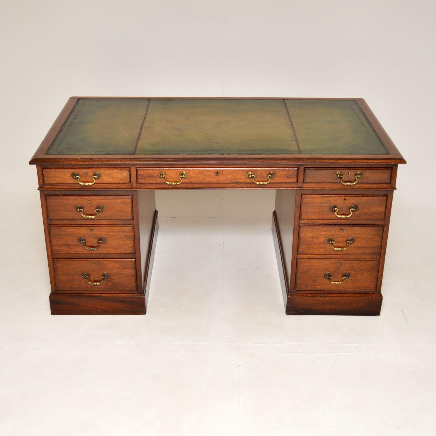 A large and very impressive antique wooden pedestal desk in the Georgian style. This was made in England & I would date it from around the 1930’s period.

This is of super quality and is a great size. The inset leather top has been revived, hand