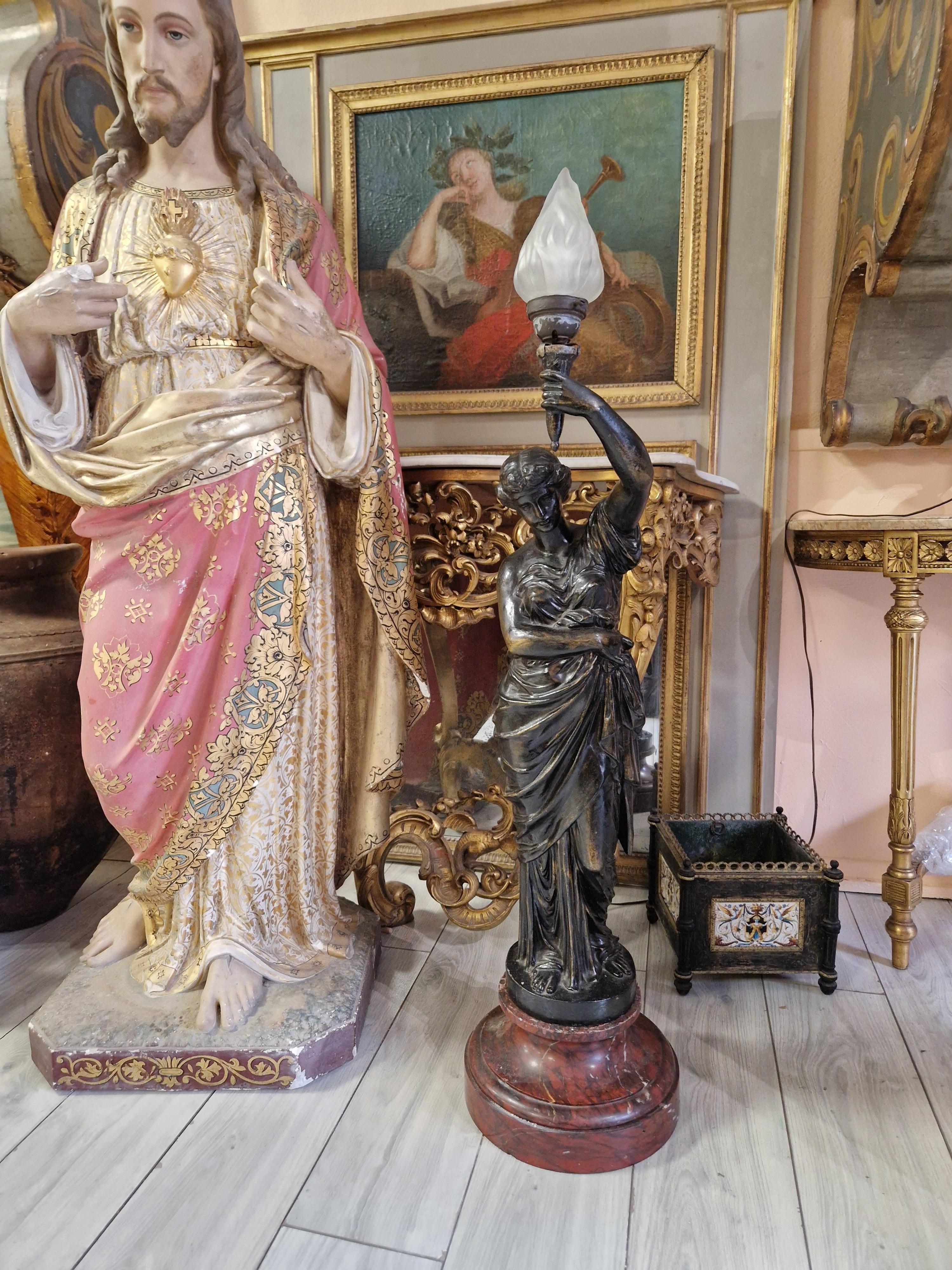 Crafted in the late 19th century, this Antique Liberty Table Lamp combines the sturdiness of cast iron with the elegance of marble, offering a timeless Neo Classical design that effortlessly enhances any room's ambiance. The lamp, featuring a single