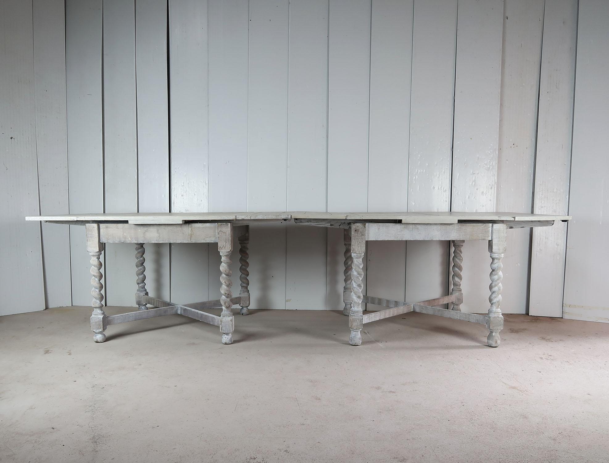 A 10 feet long informal/rustic dining table which seats 8 people comfortably.

8 twisted column or barley twist supports and two stretchers.

It consists of two near matching draw leaf tables pushed together.

It has been bleached and re-limed to