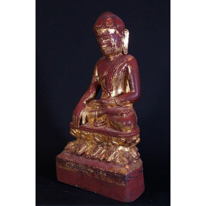 Material: wood
72 cm high 
39 cm wide
Weight: 14.9 kgs
Gilded with 24 krt. gold
Shan (Tai Yai) style
Bhumisparsha mudra
Originating from Burma
18th century
With Burmese inscriptions in front of the base.

