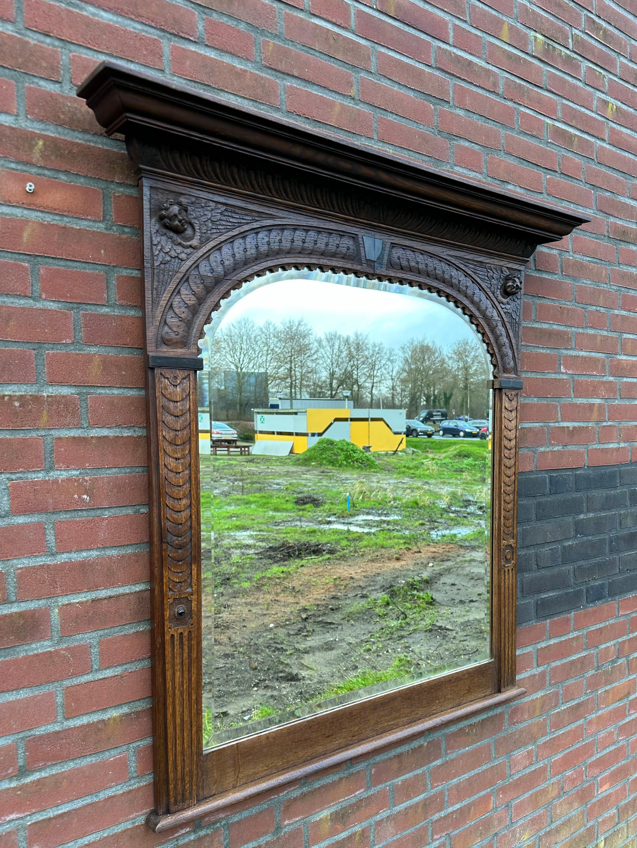 Majestic entrance or fireplace wall mirror with shelf. 

When we first saw this stunning antique mirror we immediately knew we had to have it. Also, because we felt this rare size antique is bound to grace the living space of one of our clients