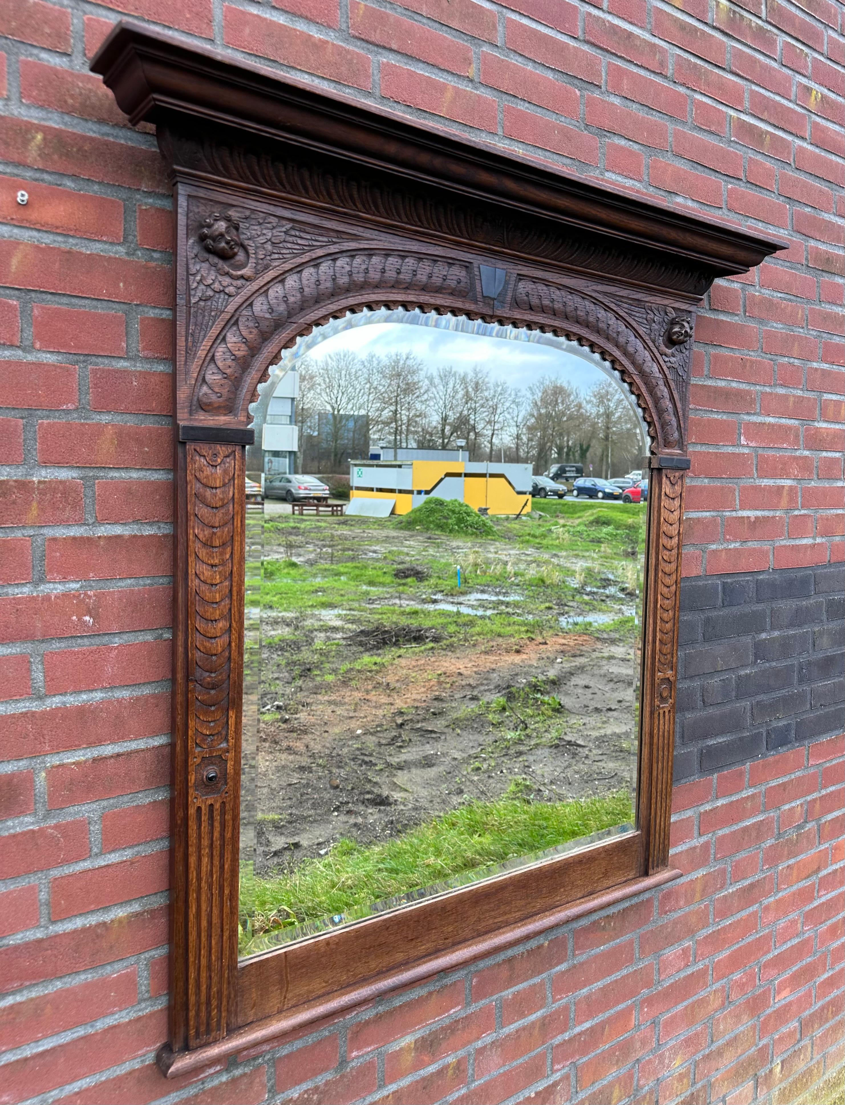 European Large Antique Magnificently Carved Renaissance Revival Wall Mirror with Angels For Sale