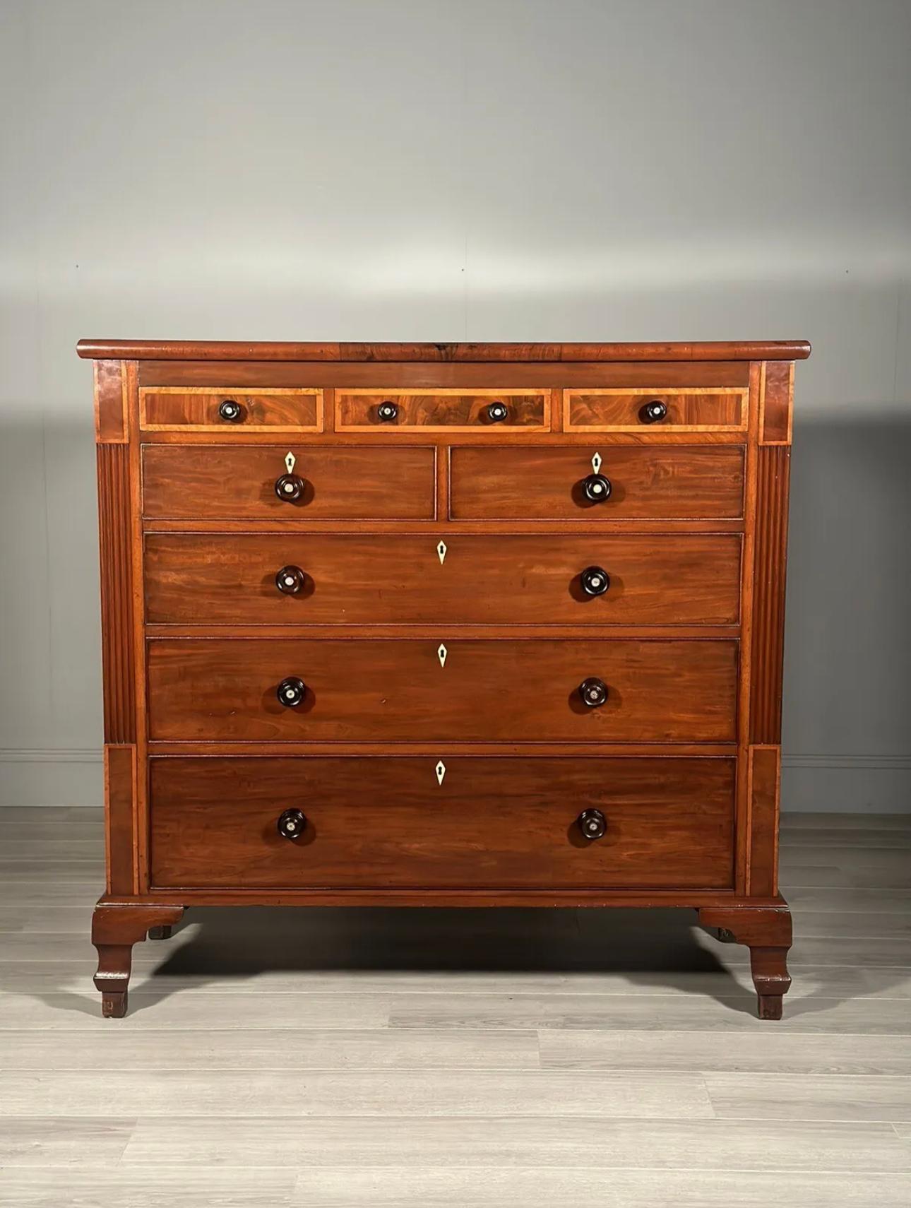 Huge antique chest of drawers dating to the early Victorian period. The chest is made from solid mahogany, satin wood banding, turned ebony handles and is in fantastic original condition. The chest consists of 3 small drawers over 2 medium drawers