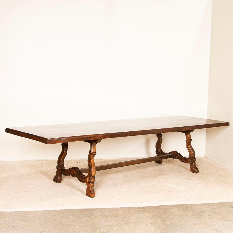 This incredible dining table beckons a family to sit, eat and linger over good conversation. At over 10 feet long, it will comfortably seat 8-10 people depending on your chairs. The natural patina of the mahogany has aged over the years, adding to