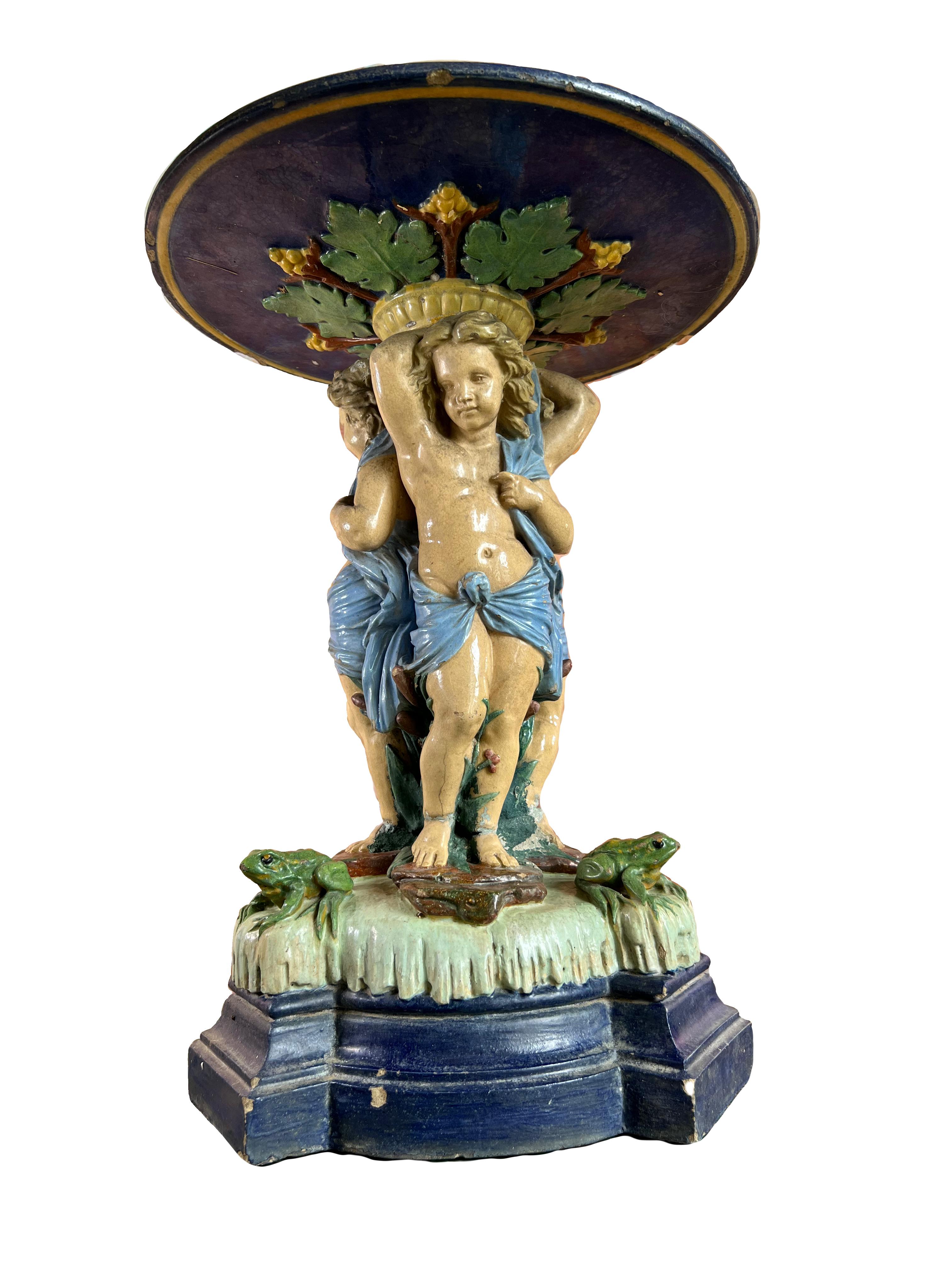 French Large antique majolica centerpiece with putti and frog 19th For Sale