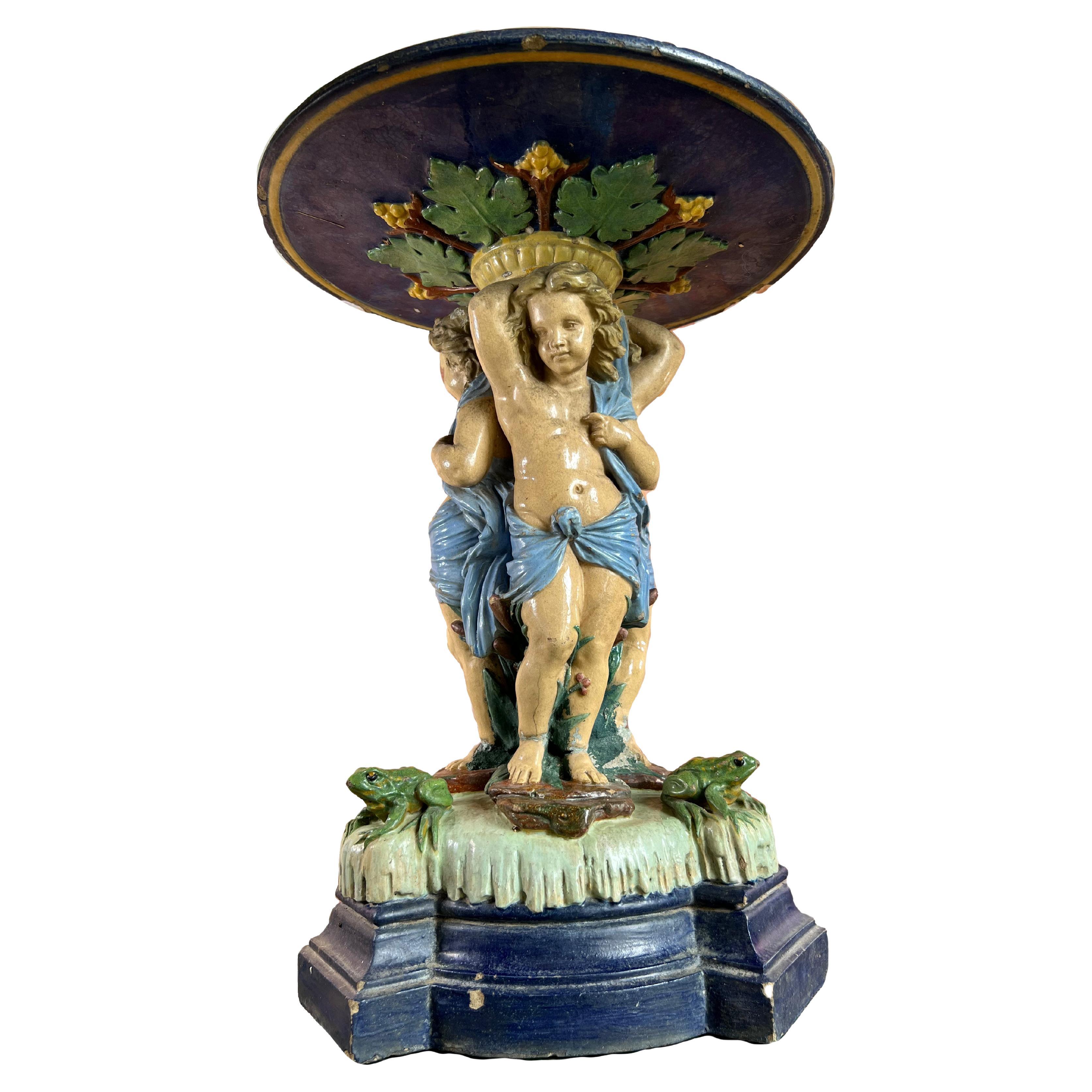 Large antique majolica centerpiece with putti and frog 19th
