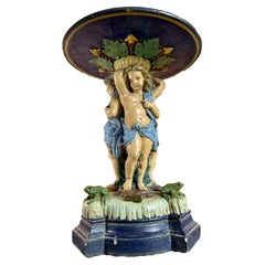 Large antique majolica centerpiece with putti and frog 19th