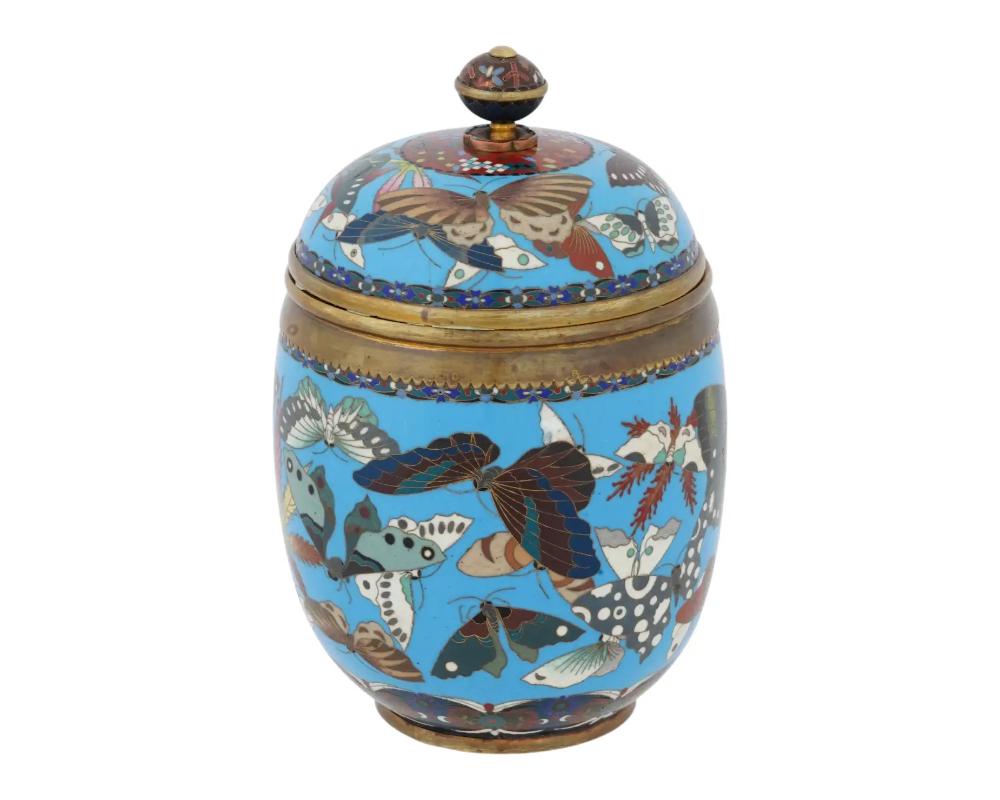 An antique Japanese gilt copper lidded jar with cloisonne enamel design.

Large Antique Meiji Japanese Cloisonne Enamel Covered Jar with Butterflies Goto

Early Meiji period, after 1868. Upright ovoid shape.

Turquoise blue ground color. Butterfly
