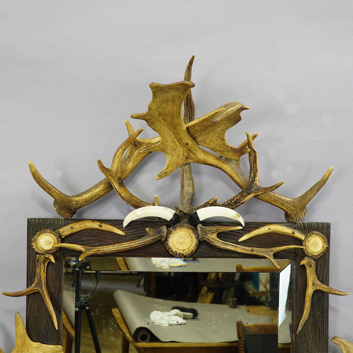 Black Forest Large Antique Mirror with Rustic Antler Decorations For Sale