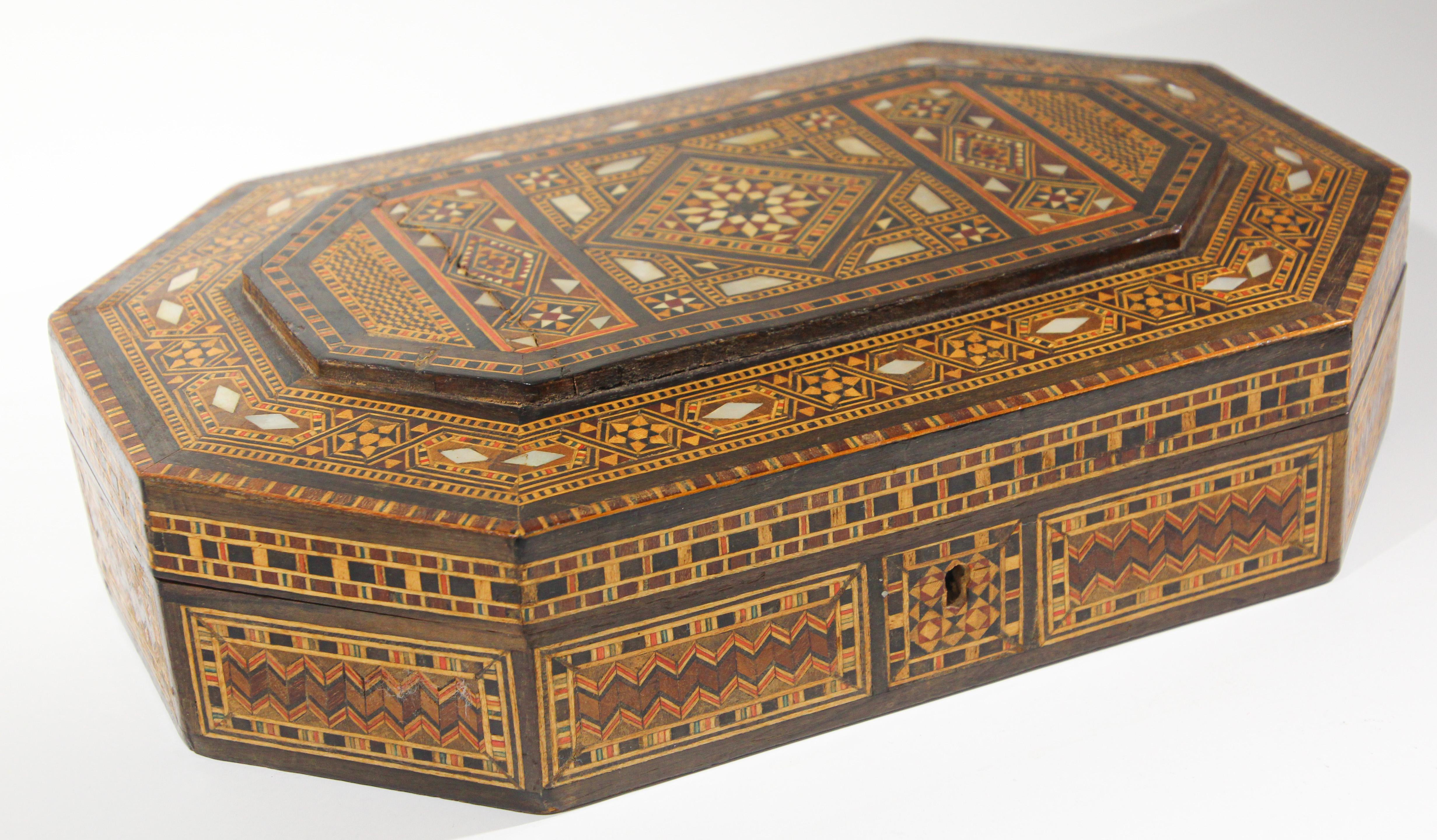 Large Middle Eastern Moorish style micro mosaic inlaid jewelry box with lid.
Intricate hexagonal shape inlaid box with geometric Moorish design.
I'm always astounded by the intricate workmanship of these boxes. The interior of the lid is also inlaid