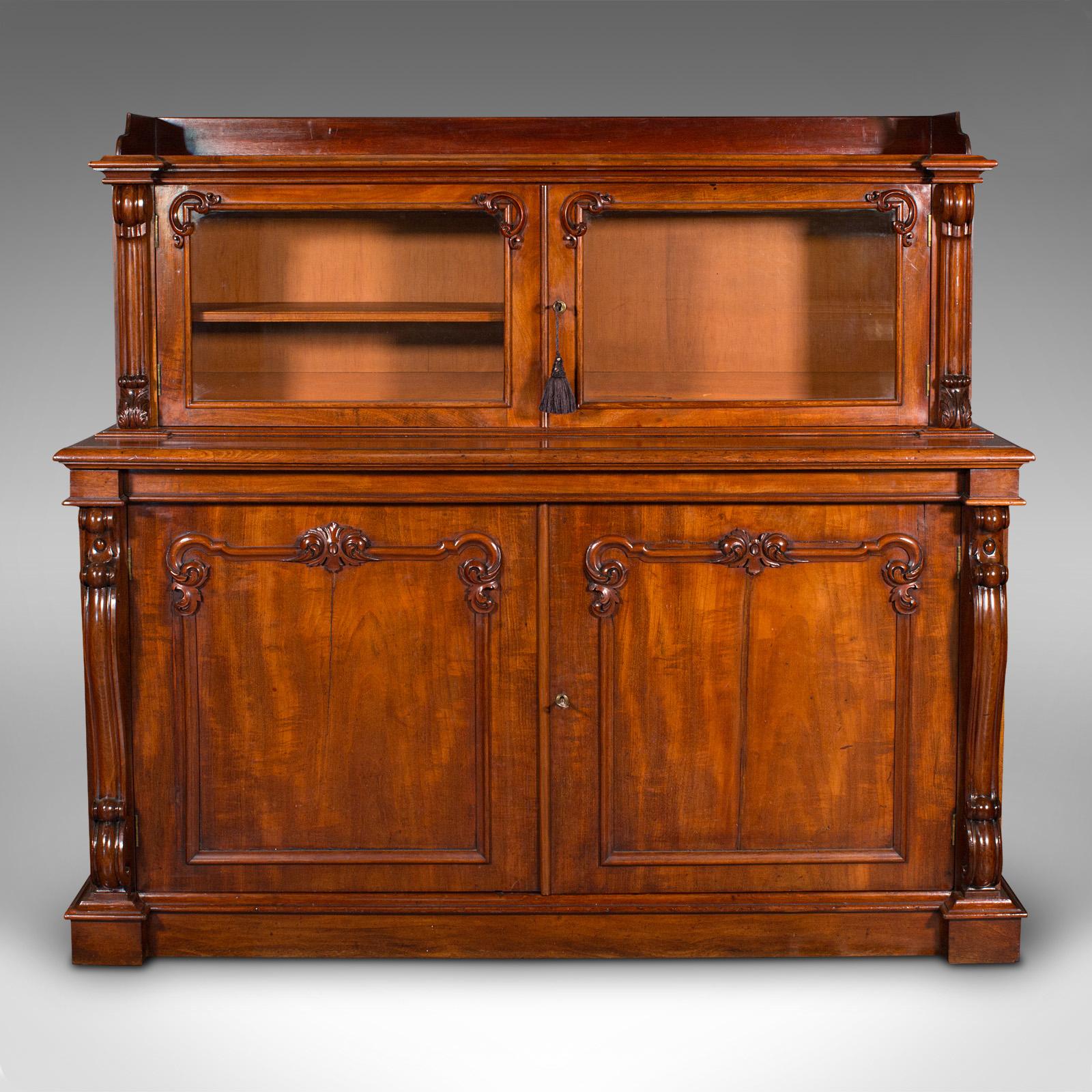 This is a large antique morning room cabinet. An English, mahogany and glass country house side cupboard, dating to the early Victorian period, circa 1840.

Fine craftsmanship and unusual in this proportion and style
Displays a desirable aged patina