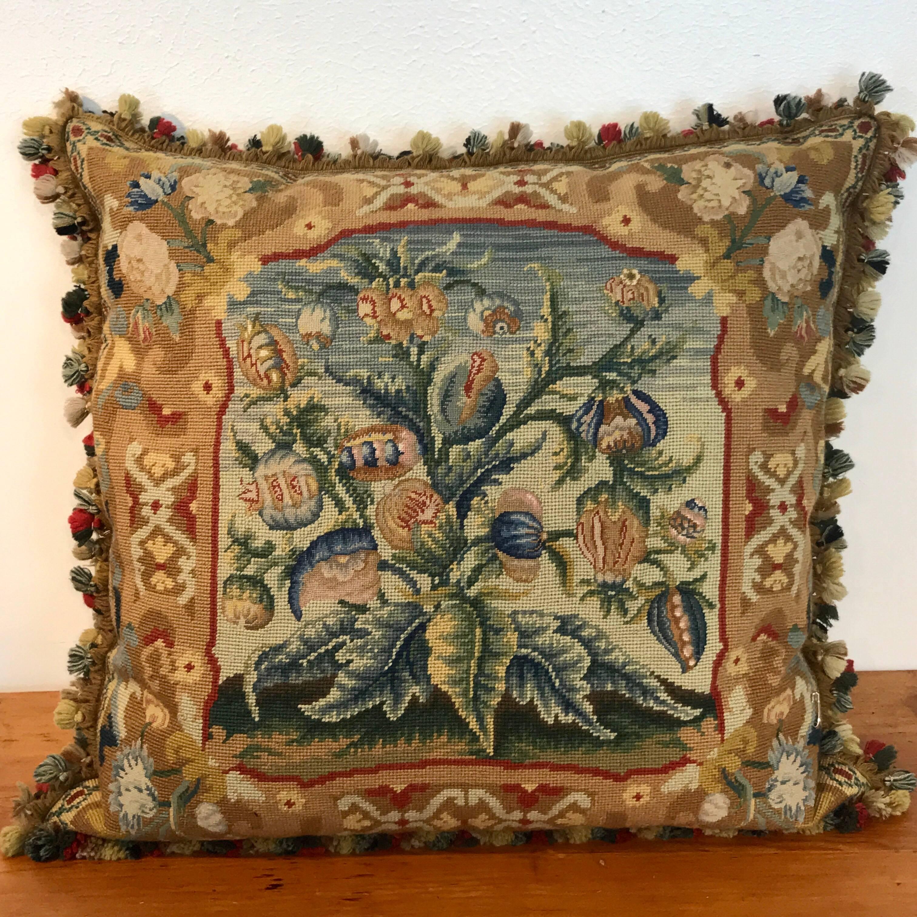 Large antique needlepoint pillow II, lush large botanical motif with tassel fringe. The pillow without the fringe measures 23