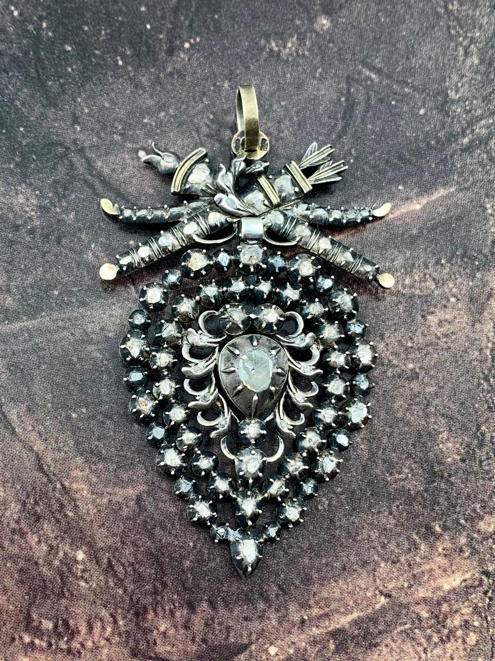 Flemish heart, Vlaams hart, Coeur de Liege, Coeur Flamand
Rare, large scale, signed Neoclassical period diamond, silver topped gold heart with love trophies pendant
Netherlands
Early 19th Century
Provenance: Important East Coast collection

This