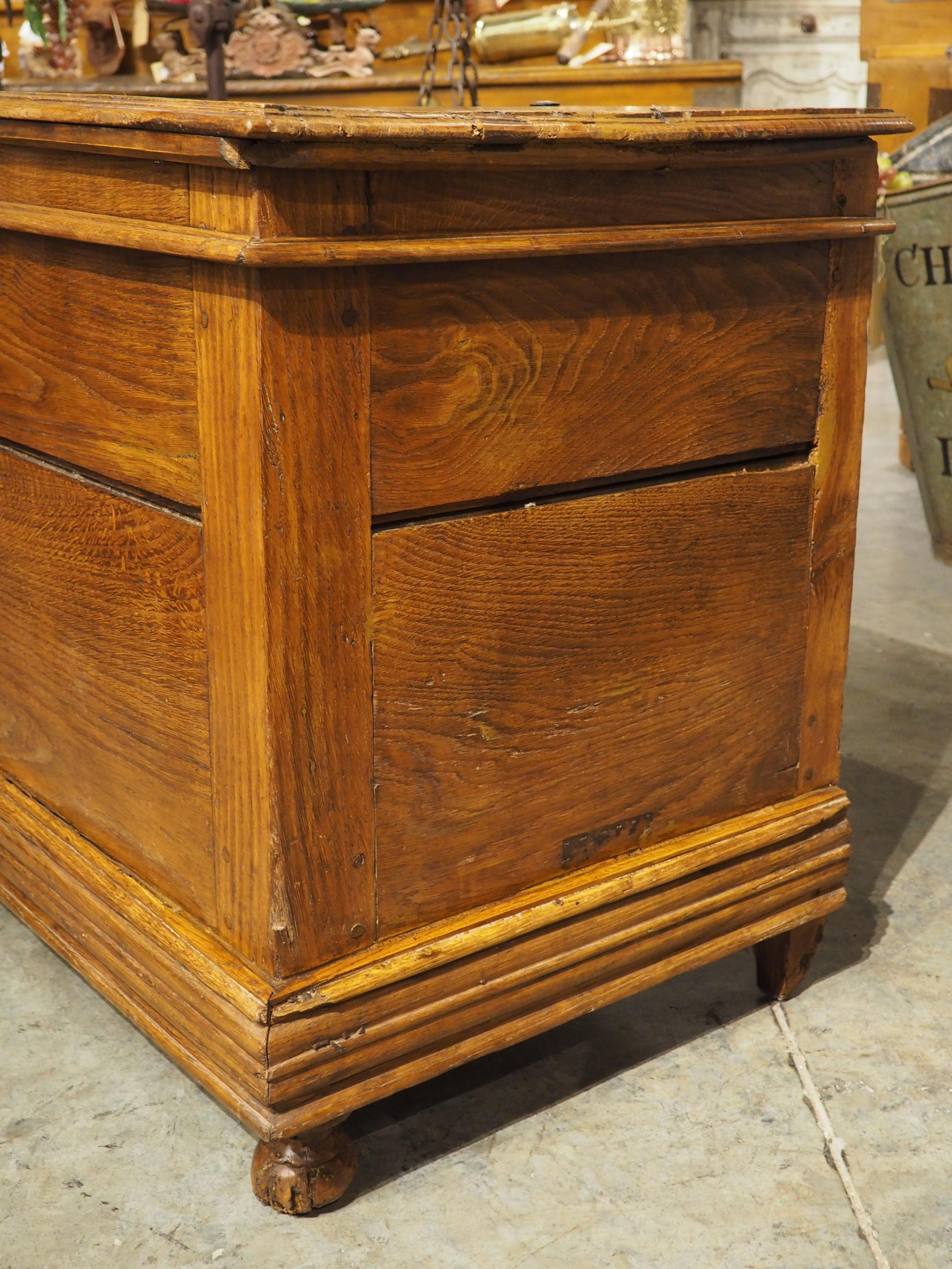 More information coming soon…

Hand-carved from oak in the early 1800s, this large chest is known in France as a coffre.  The clean lines of the chest are softened by a thick apron molding, consisting of multiple tiers of cavetto, quarter-round, and