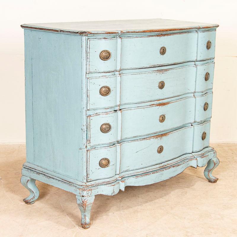This impressive large oak chest of drawers is quite dramatic thanks to the (newer) blue painted finish that has been distressed to fit the age of the chest accenting the Rococo curves and cabriolet feet. Please examine photos to appreciate the