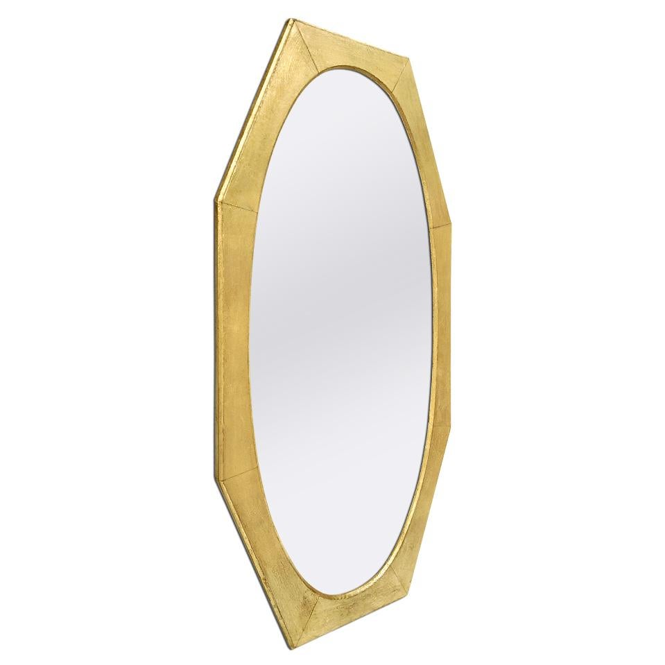 Large antique French octagonal giltwood mirror, circa 1950. The inner shape of the beveled giltwood frame is oval. Re-gilding to the leaf patinated. Modern glass mirror. Antique wood back. Antique frame width 10 cm / 3.93 in.