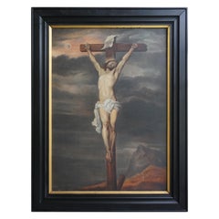 Grande peinture ancienne à l'huile sur toile représentant le Christ en croix dans un cadre ébénisé