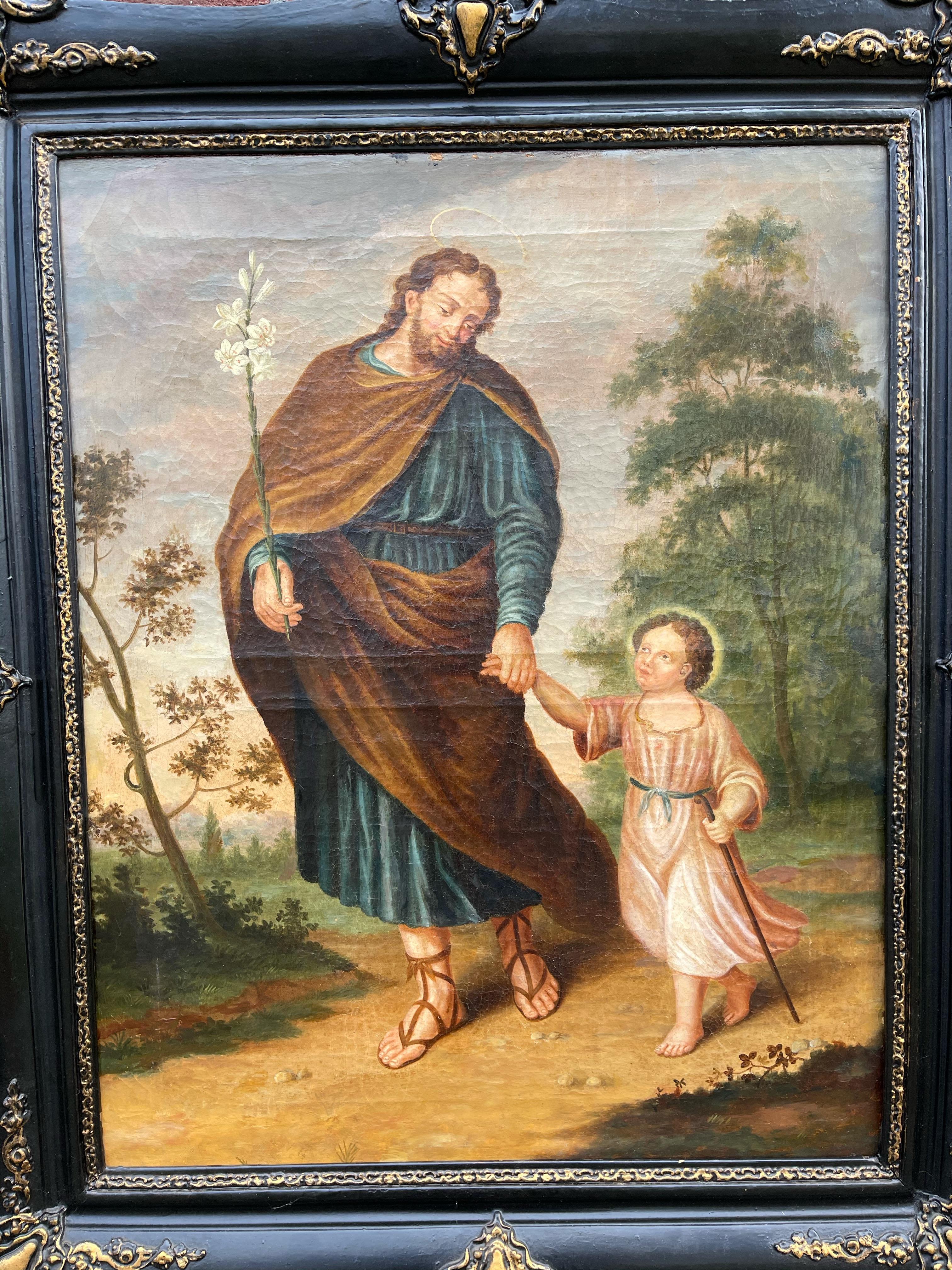 Œuvre d'art religieux ancienne, présentée dans son cadre antique d'origine.

Ce magnifique portrait édifiant de saint Joseph tenant la main de l'enfant Jésus est une huile sur toile datant du 18e siècle et de l'ère du renouveau baroque en Europe. Ce