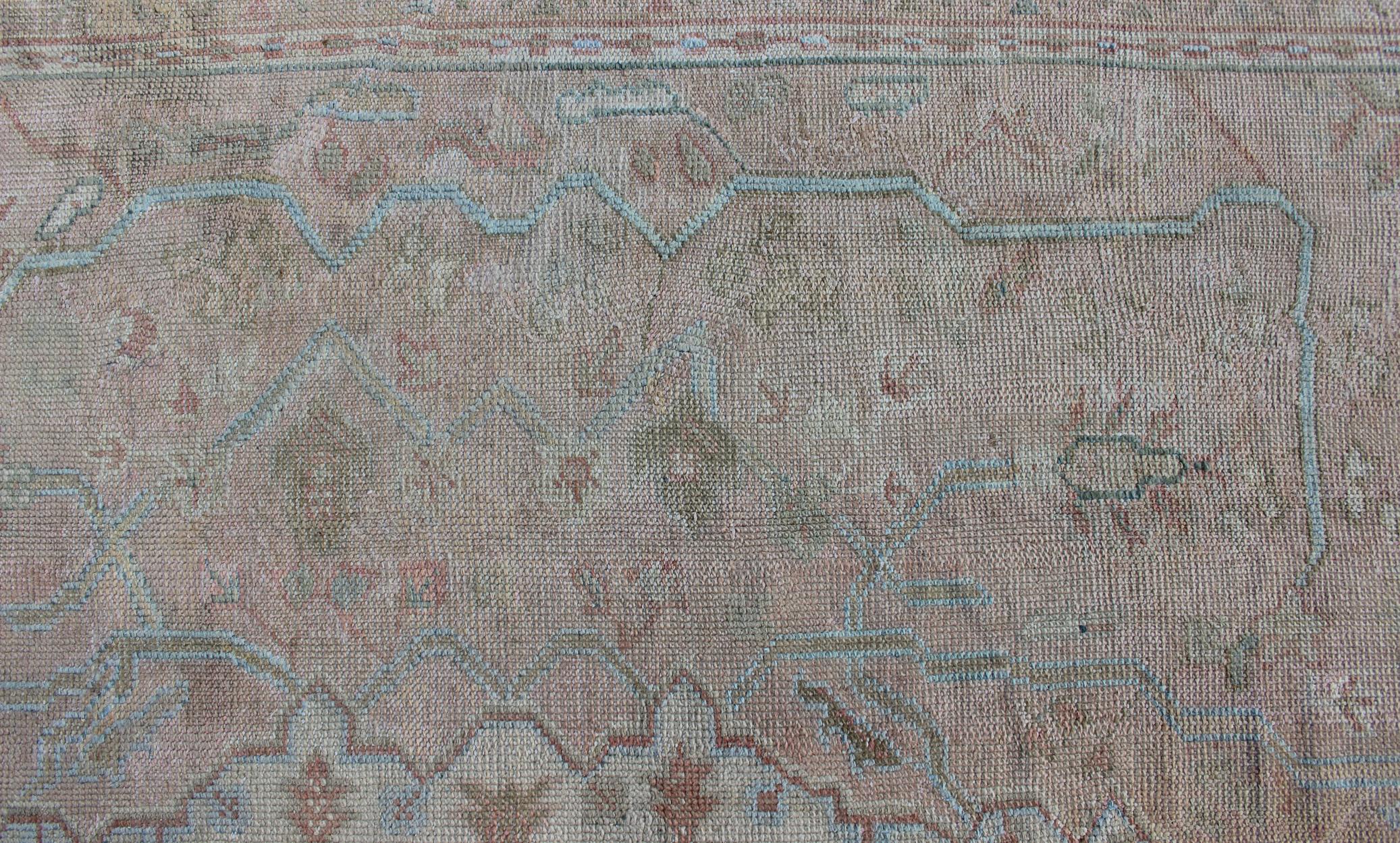 Large Antique Oushak Carpet in Light Pink Background with Light Blue Highlights In Good Condition For Sale In Atlanta, GA