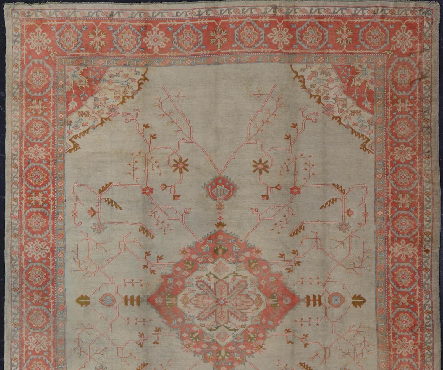Large antique Turkish Oushak rug in light green background and coral border. Keivan Woven Arts / rug N15-1002, country of origin / type: Turkey / Oushak, circa Early-20th century.
Measures: 13'4 x 18'.
Delicate light sea-foam, taupe and coral imbue