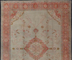 Large Antique Oushak Rug in Taupe / Light Green Background and Coral Border
