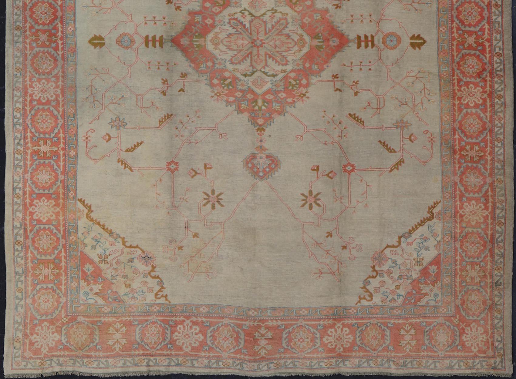 Turkish Large Antique Oushak Rug in Taupe / Light Green Background and Coral Border For Sale