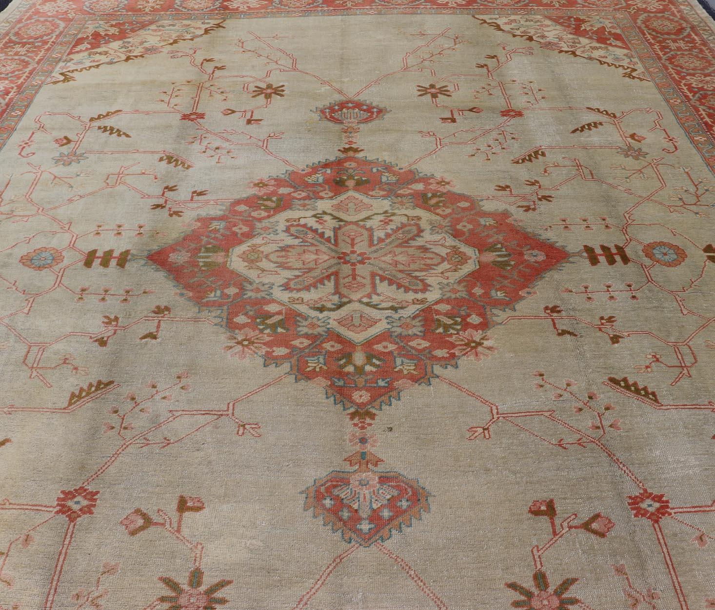 Wool Large Antique Oushak Rug in Taupe / Light Green Background and Coral Border For Sale