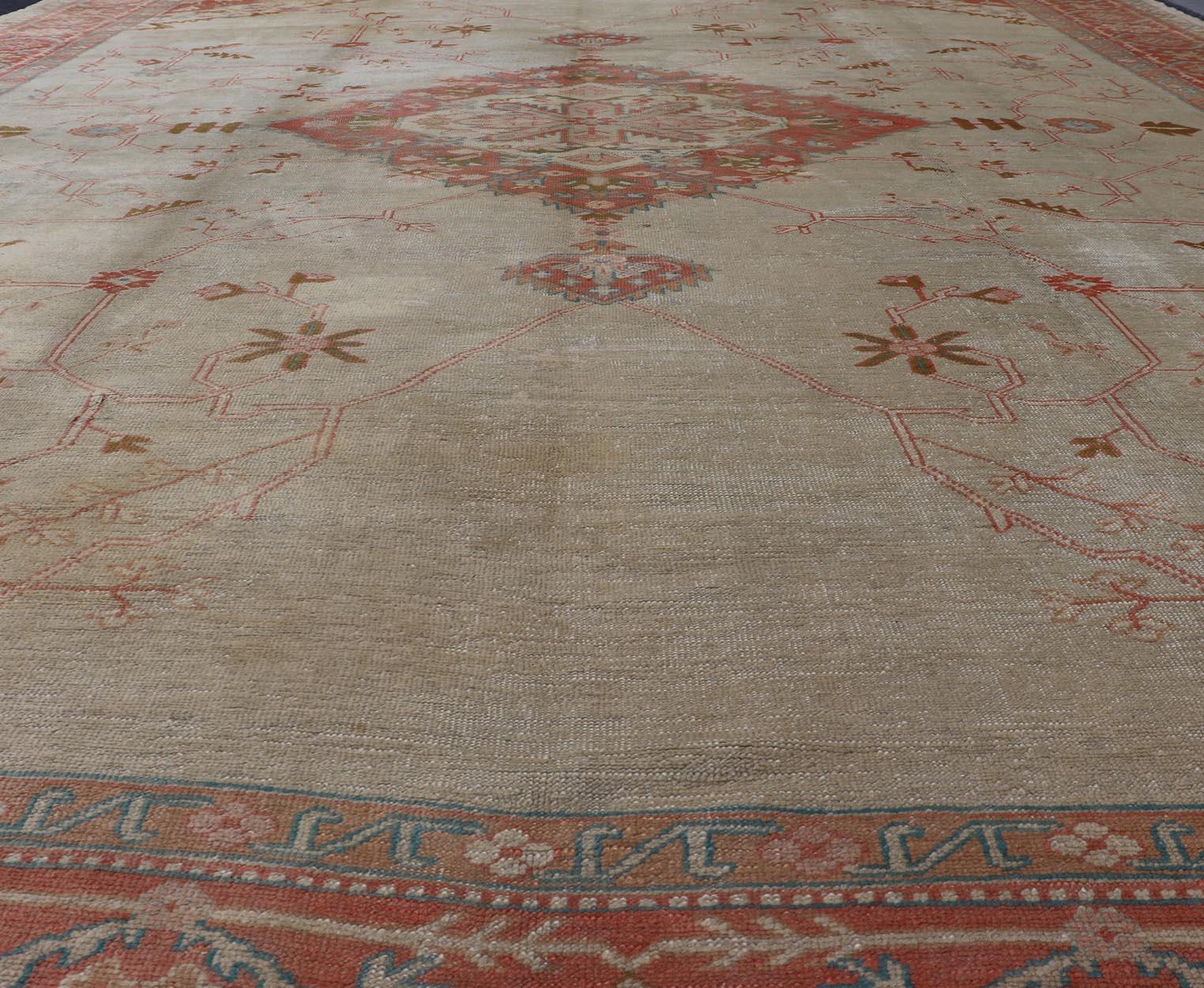 Large Antique Oushak Rug in Taupe / Light Green Background and Coral Border For Sale 1