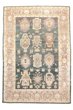 Large Antique Oushak Rug with a Teal Field