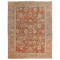 Alfombra antigua grande de Oushak con diseño floral en naranja suave, topo y verde claro