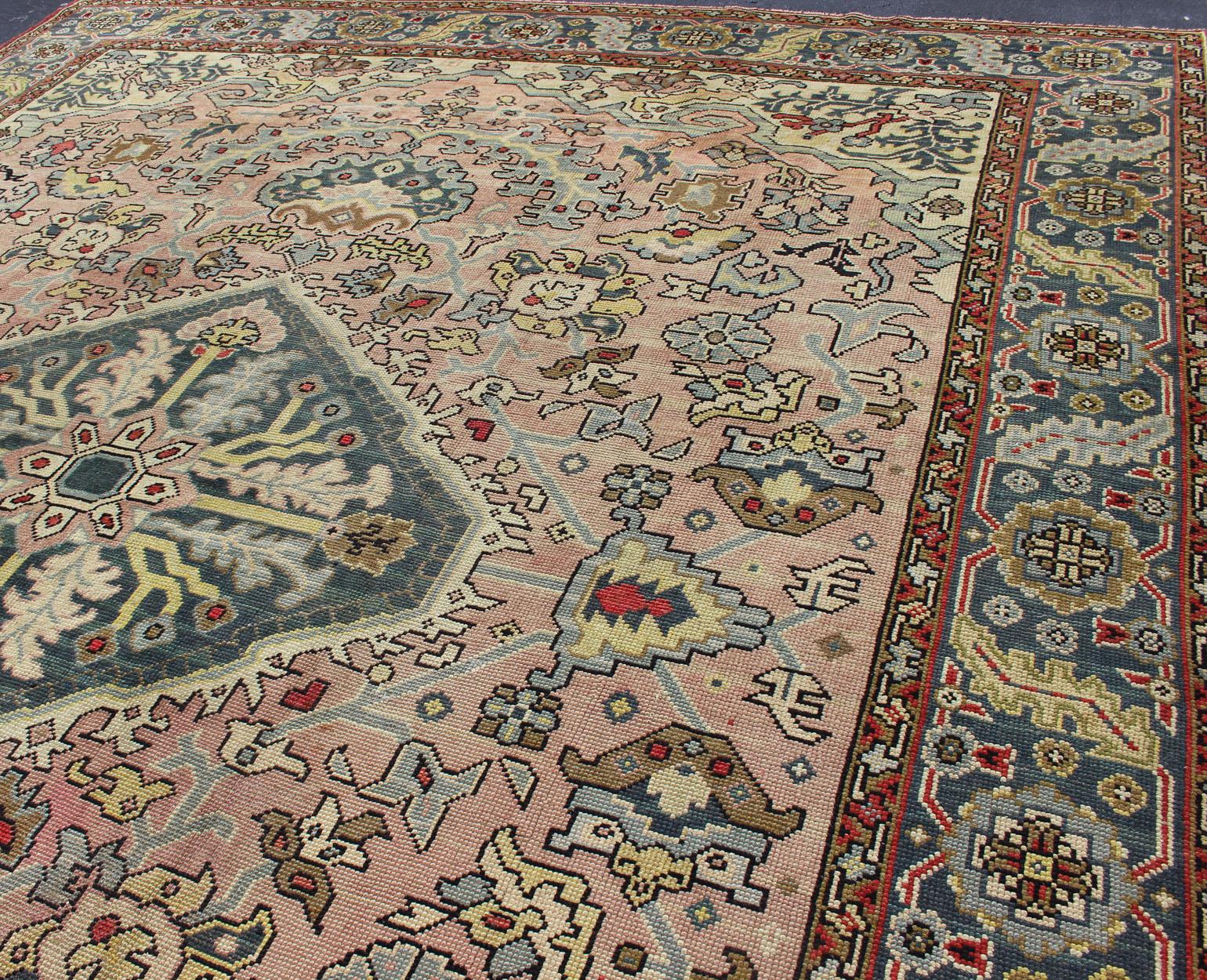 Large Antique Oushak Rug with Floral Design in Pink and Steel Blue   13' x 16' In Excellent Condition For Sale In Atlanta, GA