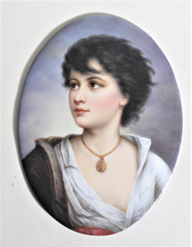 This antique hand painted portrait is unsigned, but done in Europe, most likely Austria or Italy in circa 1890 in the period Victorian style. This well executed portrait depicts a young female in period dress with wind blown hair and her blouse